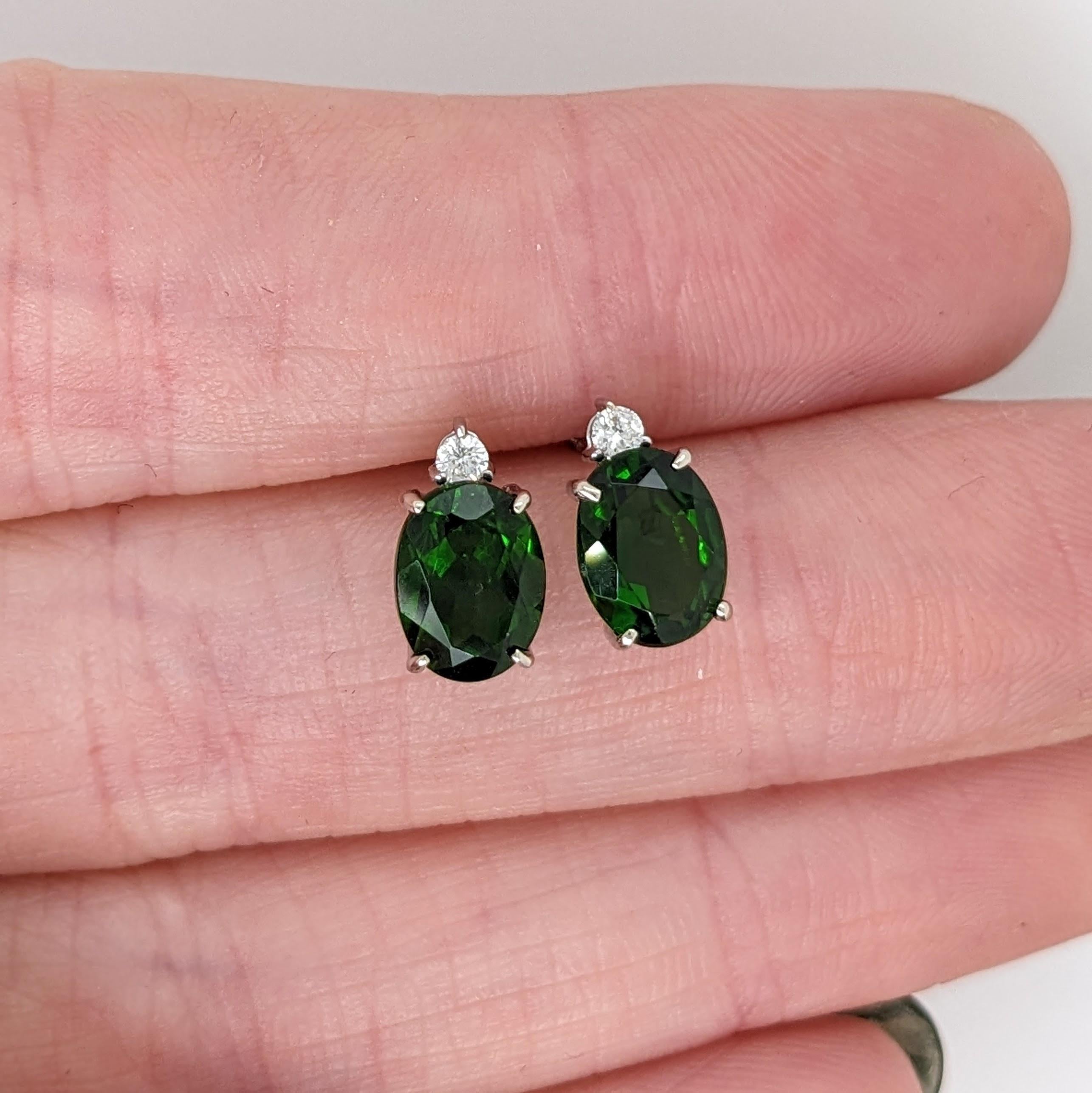 These fabulous chrome diopside studs are an absolutely stunning rich green color! A beautiful diamond accent gives a little extra sparkle to these gorgeous earrings. 😊

Specifications:

Item Type: Earrings
Centre Stone: Chrome Diopside
Treatment:
