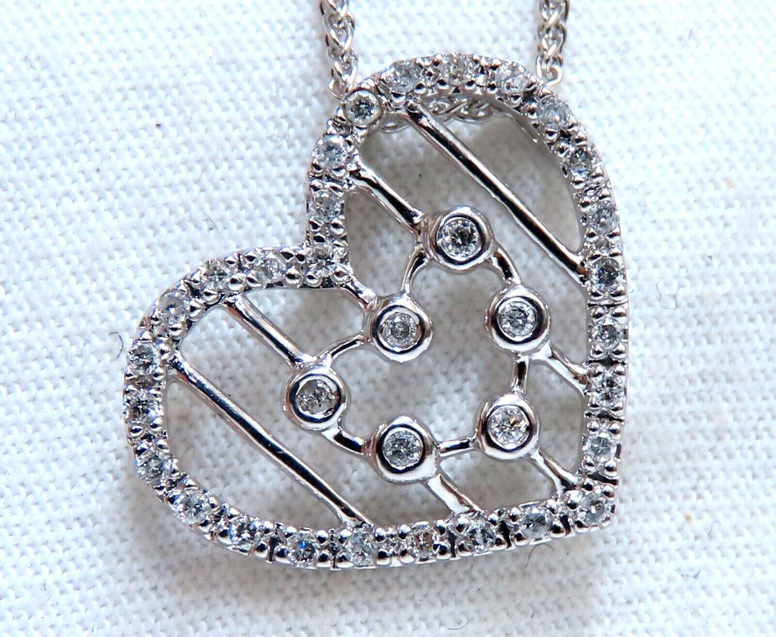 Loves & Sparkles.
.22ct. Natural diamonds heart necklace.

 Full cut and Brilliant

H-color, si2 clarity

Pendant Measurements: 

19 x 17mm

18 inch necklace 

Total 5.3 grams

14kt. white gold.