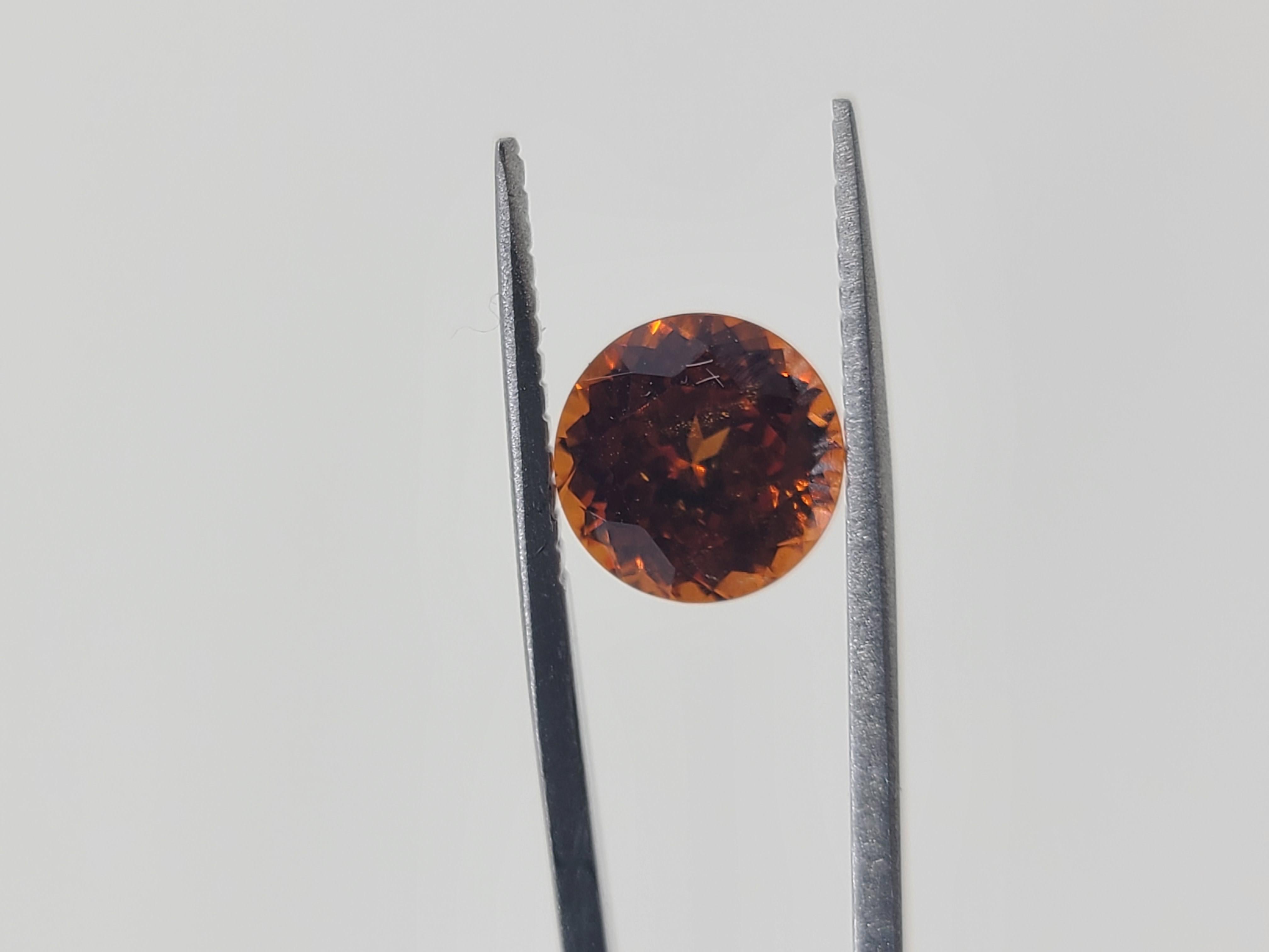 A must-have for the avid gemstone collector, or set this stunning spessartine garnet into your next jewelry design. 

This naturally stunning garnet exhibits a deep yellow and reddish-orange hues, amplified by its symmetrical shape measuring 8mm