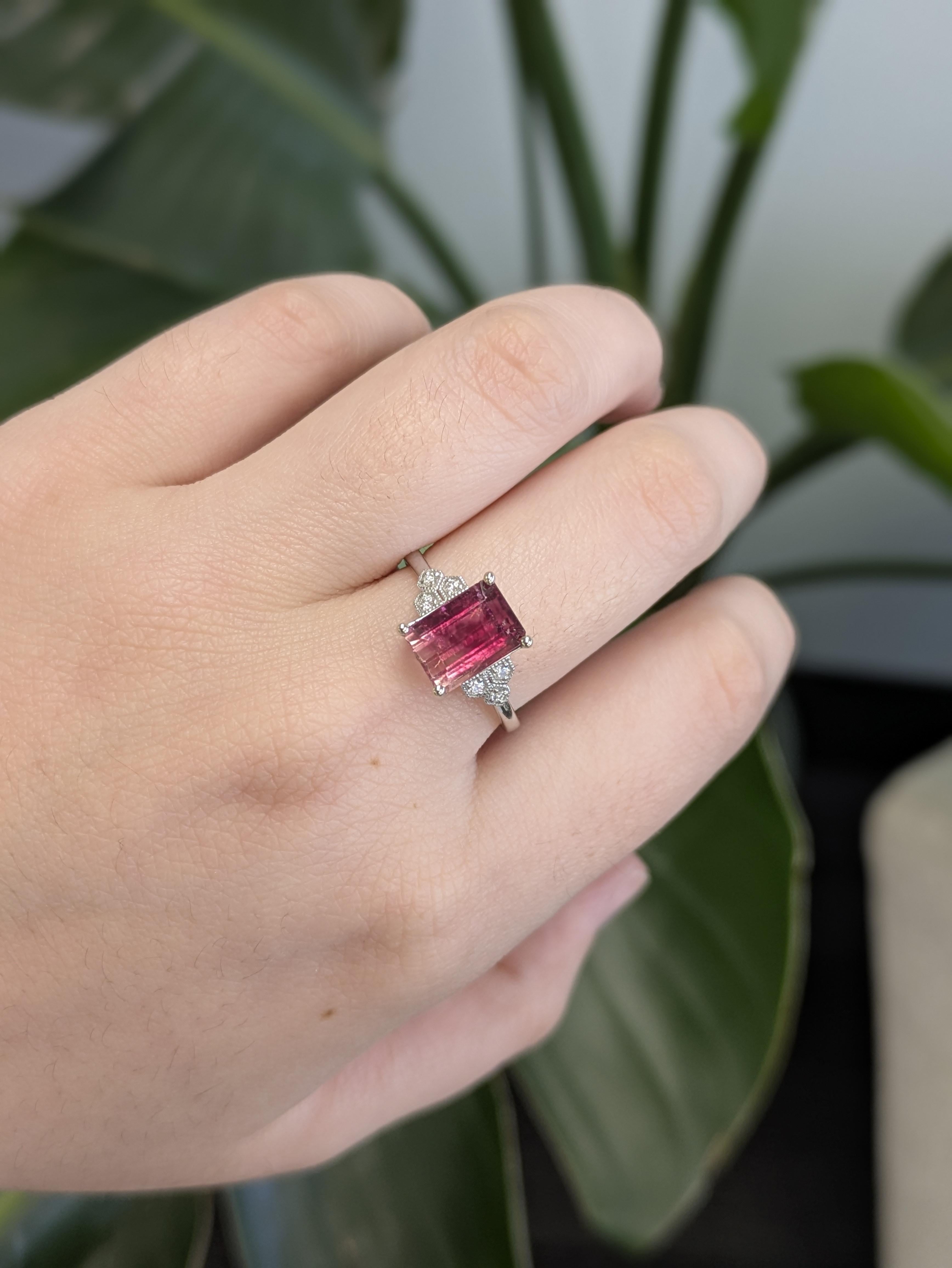Make a bold statement with this pink bicolor tourmaline ring, emerald-cut for striking elegance. Set in solid 14k white gold and accented with natural diamonds, it's a perfect blend of color, clarity, and modern sophistication.

