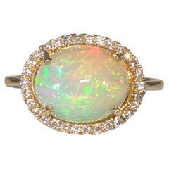 2.6cts Opal Ring with Diamond Halo: 14K Yellow Gold  Oval 12X9mm
