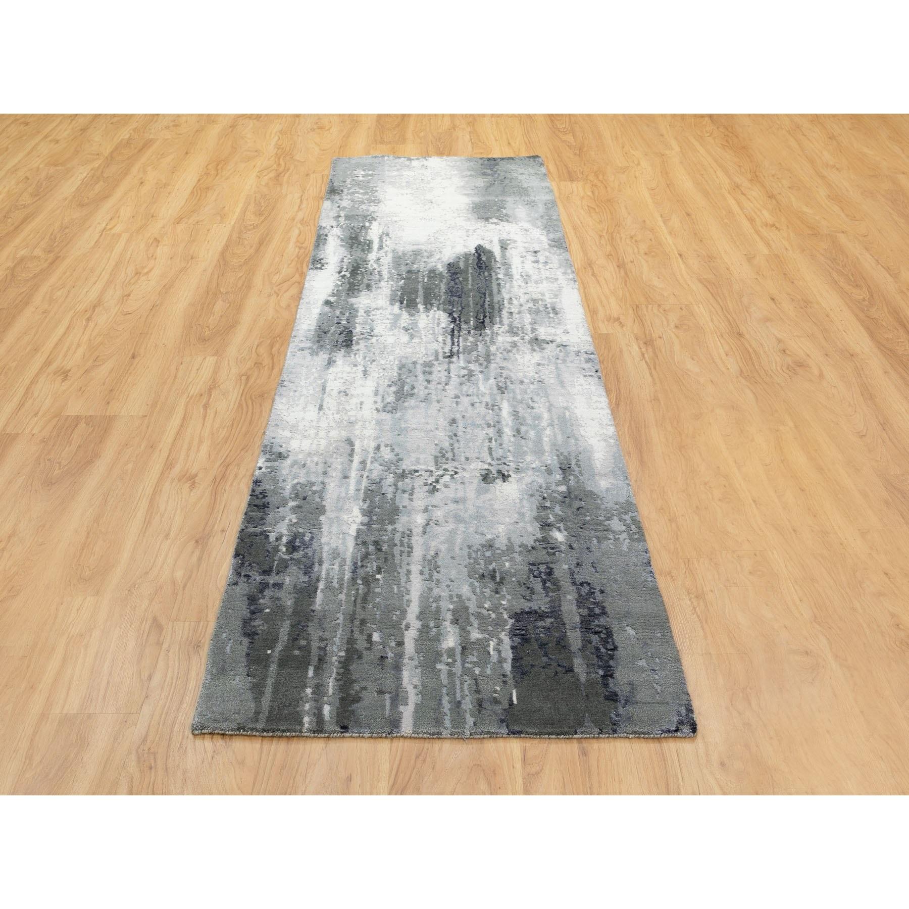 This is a truly genuine one-of-a-kind Charcoal Black Abstract Design Wool and Silk Hand Knotted Wide Runner Oriental Rug. It has been Loomed for months and months in the centuries-old weaving craftsmanship techniques by expert artisans.
Primary