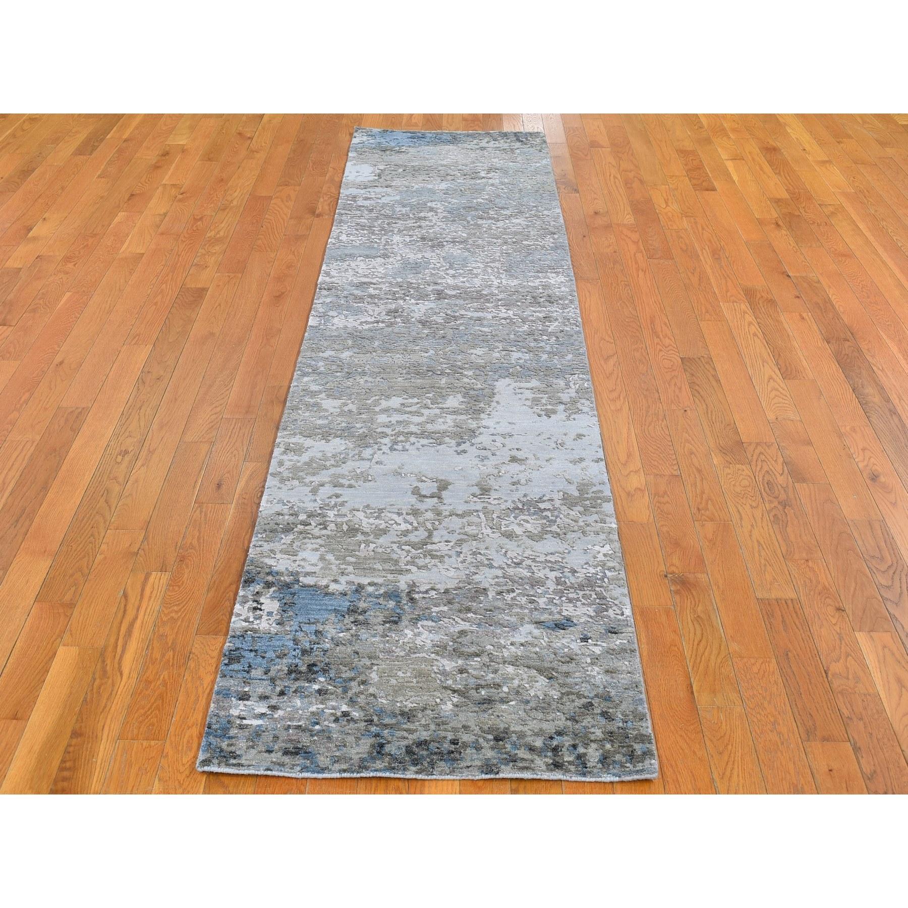 This is a truly genuine one-of-a-kind Abstract Design Wool and Silk Hi-Low Pile Gray Denser Weave Hand Knotted Runner Oriental Rug. It has been woven for months and months in the centuries-old Persian weaving craftsmanship techniques by expert