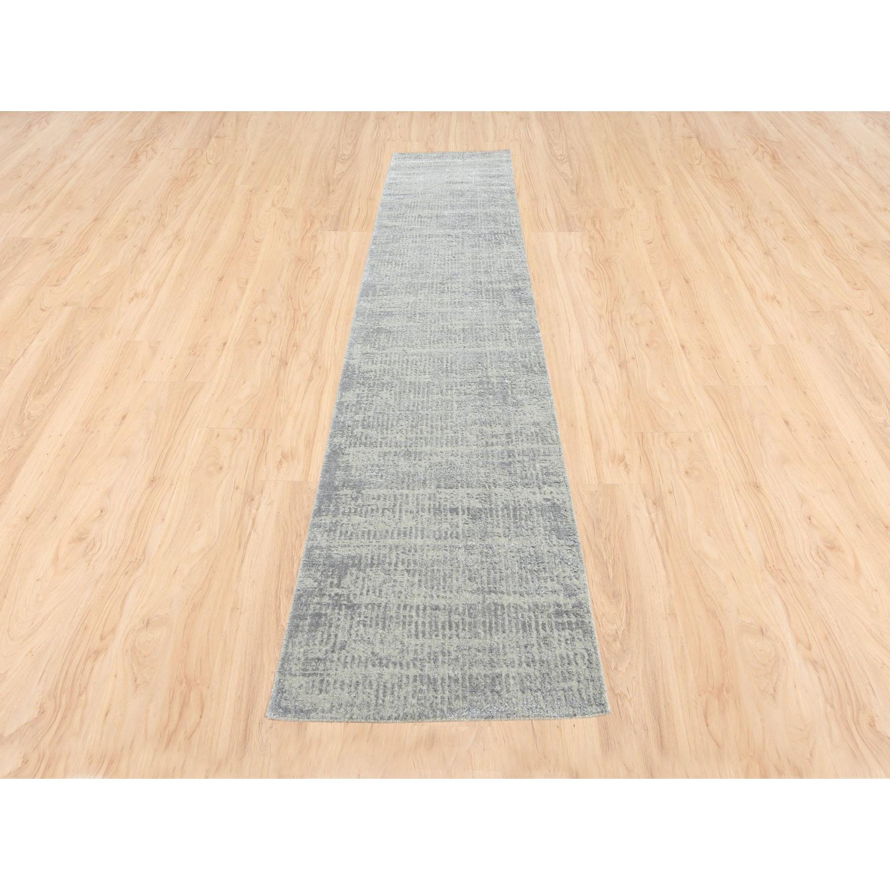 This is a truly genuine one-of-a-kind Hand Loomed Fine Jacquard Gray Modern Wool and Art Silk Oriental Runner Rug. It has been Loomed for months and months in the centuries-old weaving craftsmanship techniques by expert artisans.
Primary materials: