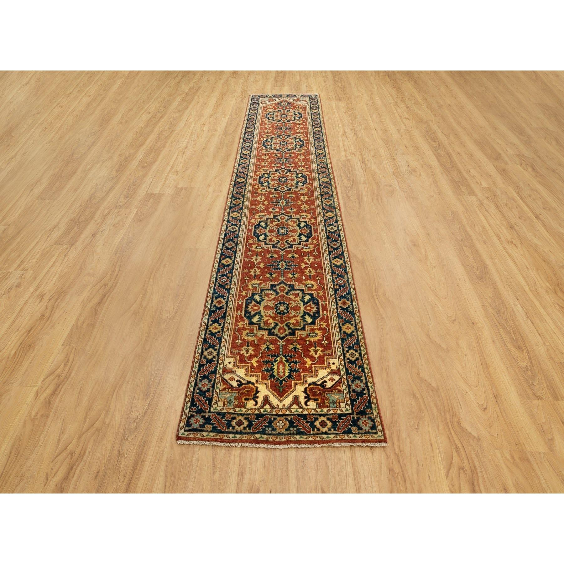 This is a truly genuine one-of-a-kind Organic Wool Red Antiqued Heriz Re-Creation Hand Knotted Oriental Runner Rug. It has been Knotted for months and months in the centuries-old weaving craftsmanship techniques by expert artisans.
Primary