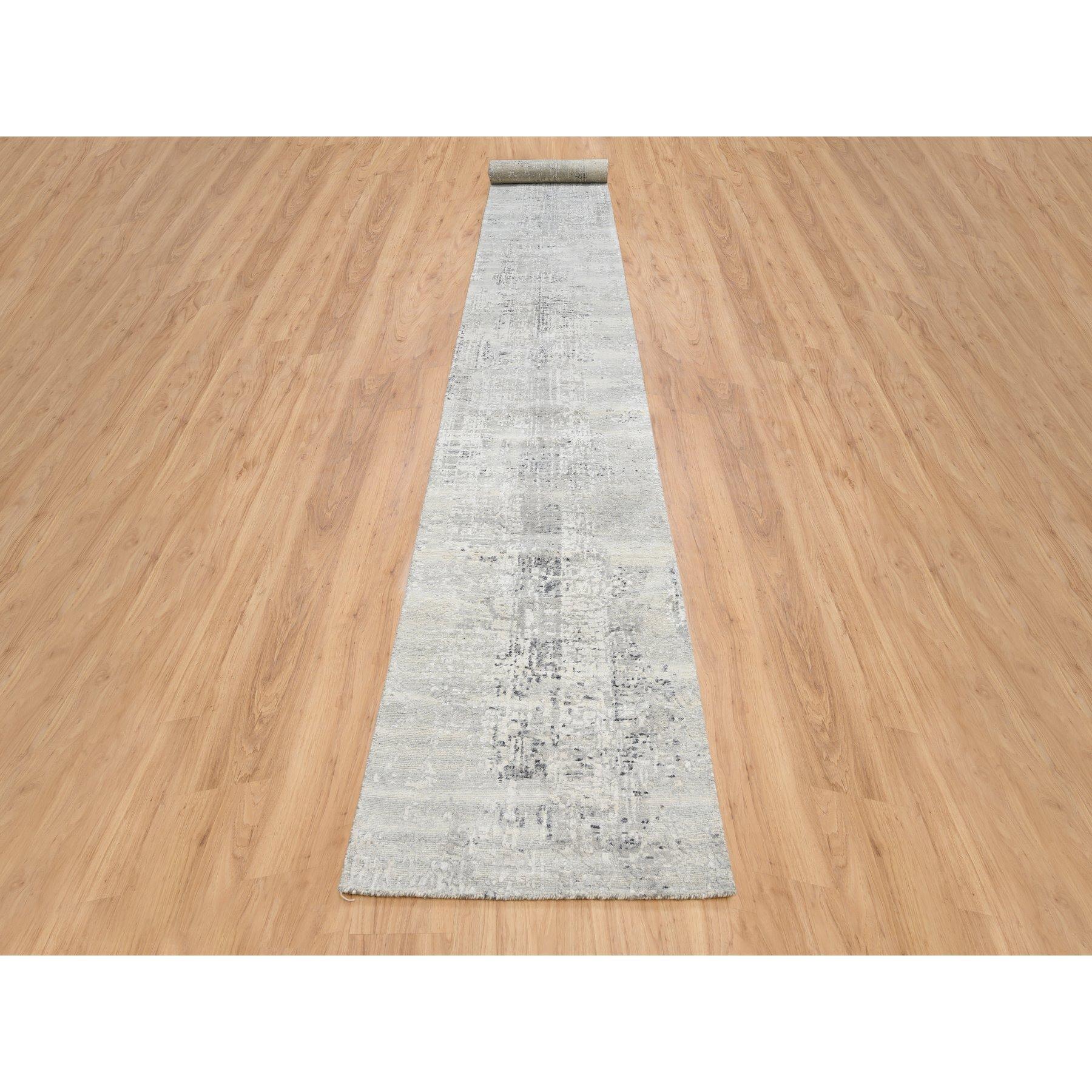 This is a truly genuine one-of-a-kind Gray Modern Hand Knotted Cut and Loop Pile Hand Spun Undyed Natural Wool XL Runner Oriental Rug. It has been Knotted for months and months in the centuries-old weaving craftsmanship techniques by expert