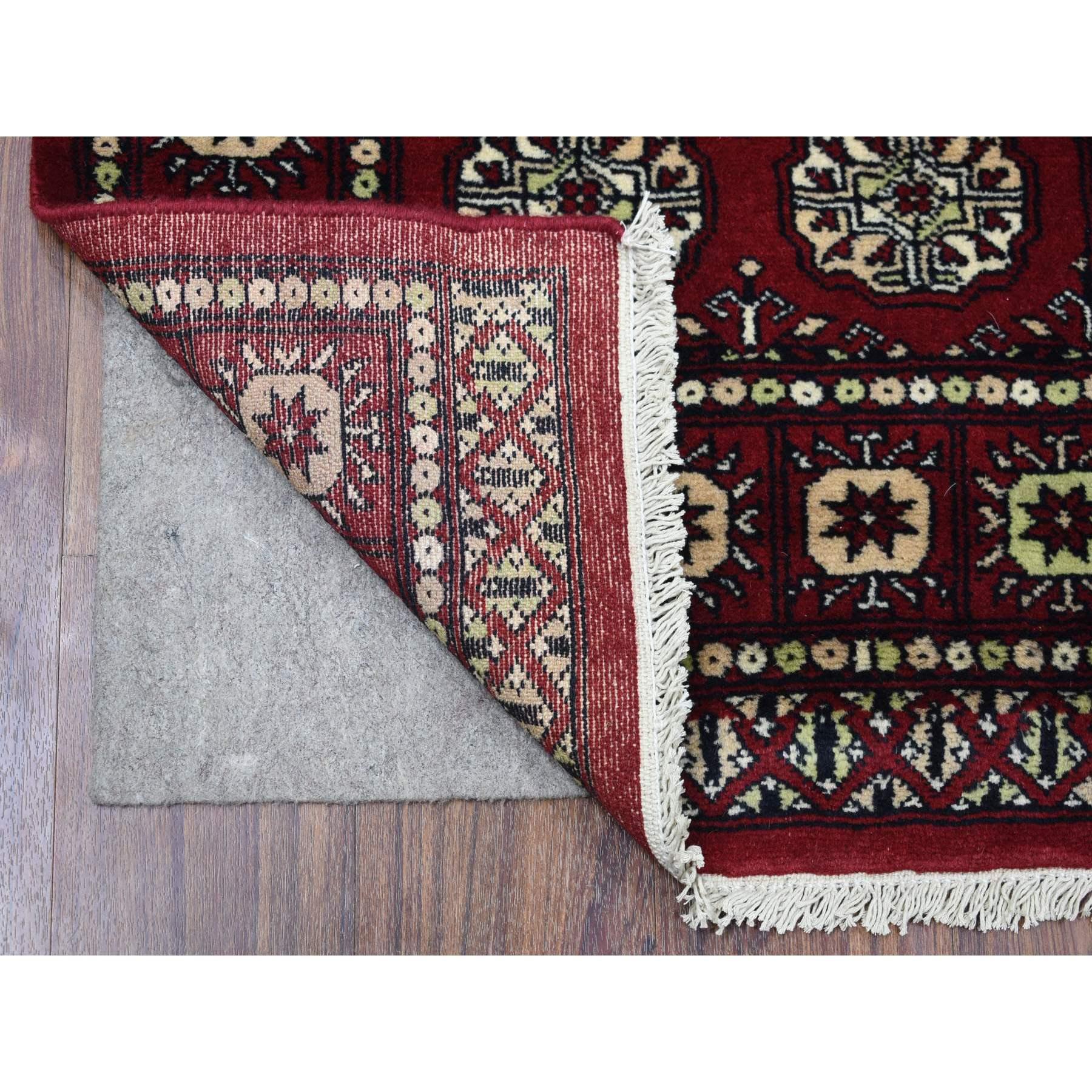 This is a truly genuine one-of-a-kind Mori Bokara with Geometric Medallions Design Deep and Rich Red Pure Wool Hand Knotted Oriental Rug. It has been Knotted for months and months in the centuries-old weaving craftsmanship techniques by expert