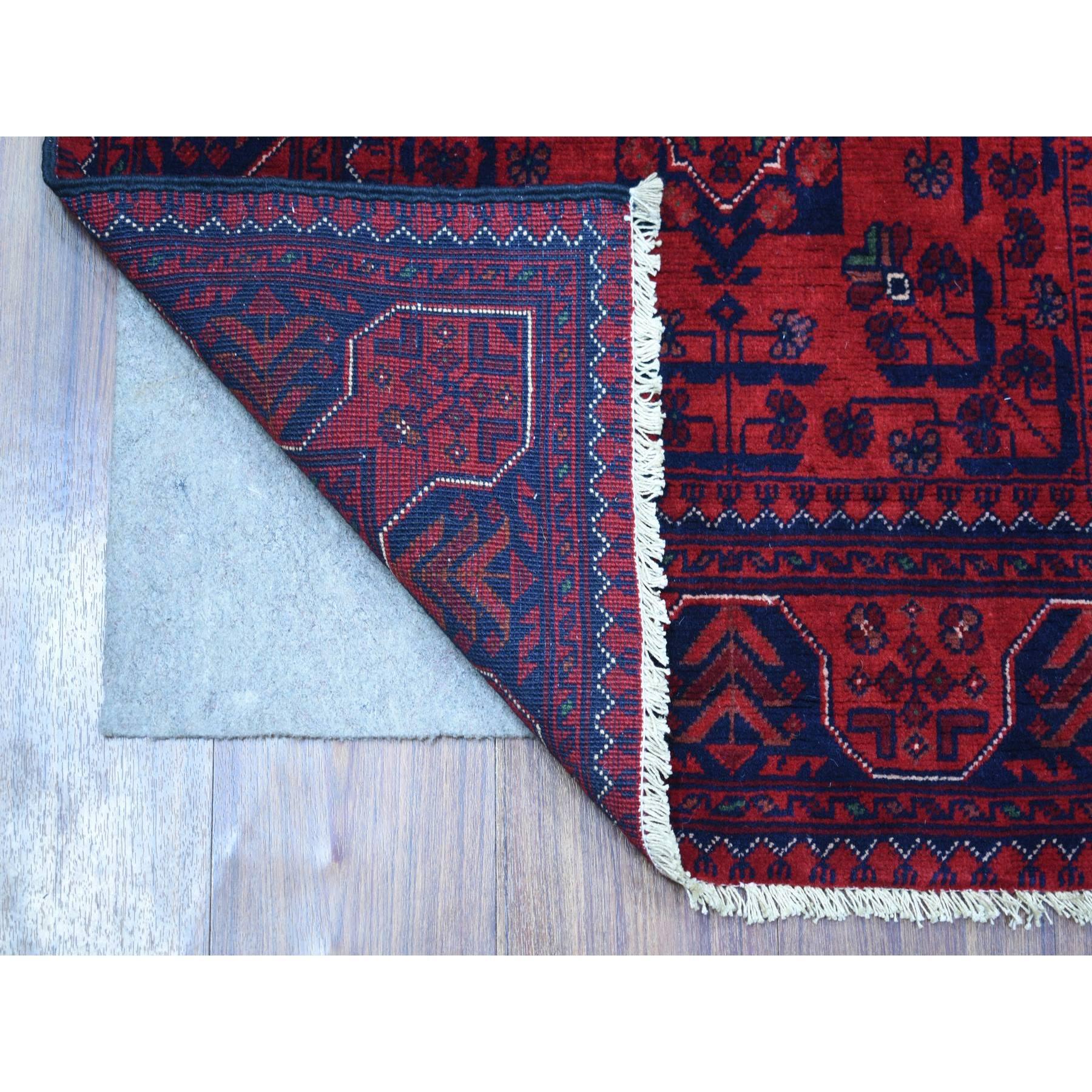 This is a truly genuine one-of-a-kind Deep and Saturated Red with Mix of Navy Blue, Afghan Khamyab with Geometric Design, Pure Wool Hand Knotted, Runner Oriental Rug. It has been Knotted for months and months in the centuries-old weaving