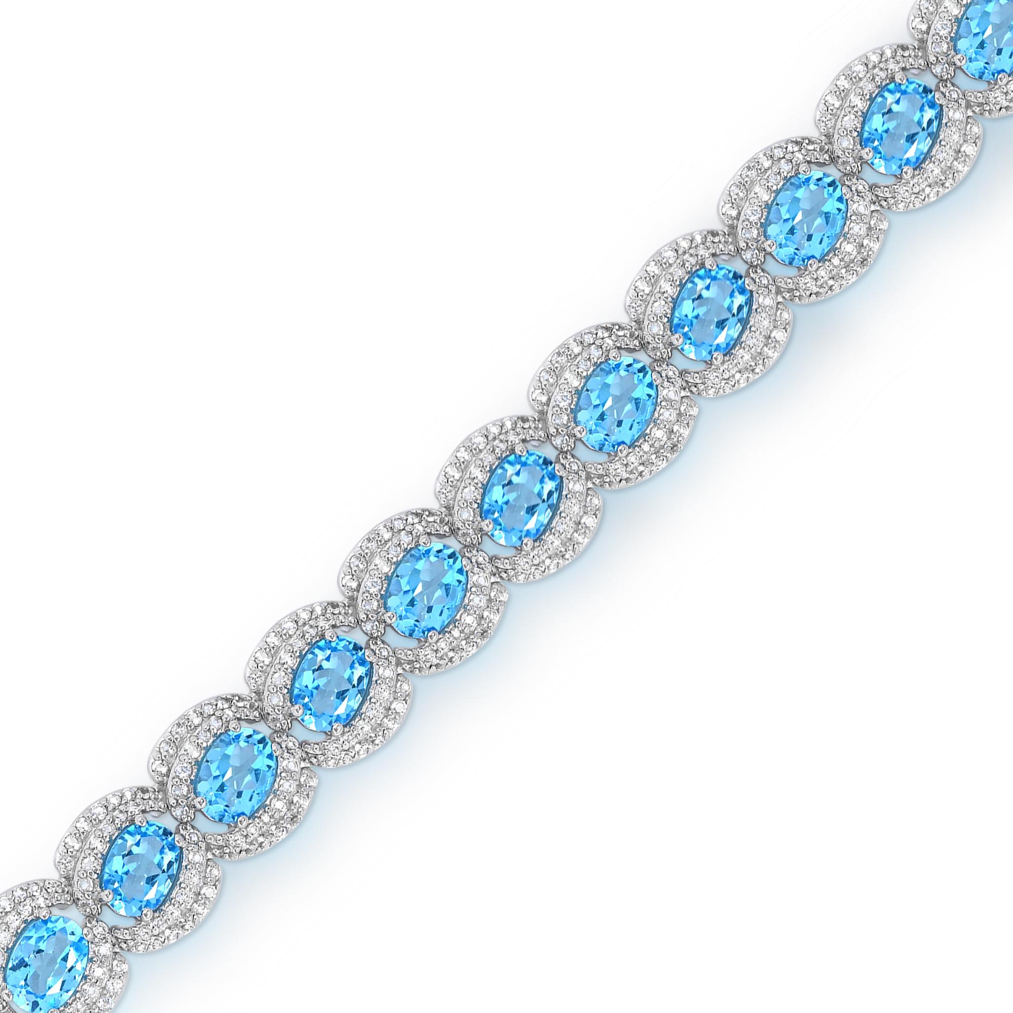 This bracelet is a statement piece for those seeking elegance and sophistication. Crafted with meticulous attention to detail, this bracelet features 19 oval-cut Swiss blue topaz gemstones, delicately accented with 532 pieces of shimmering white