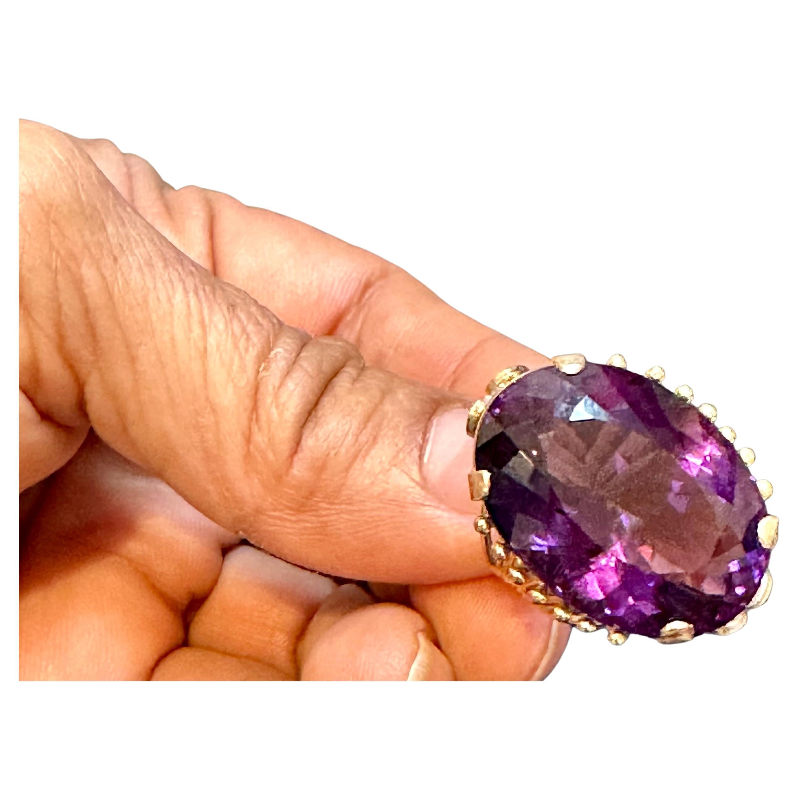 Approximately 27 Carat Beautiful  Amethyst Cocktail Ring in 14 Karat Yellow Gold Size 5.5
This is a Beautiful Cocktail ring ring which has a large approximately 20 carat of high quality Amethyst . Color and clarity is extremely nice. Large Oval cut