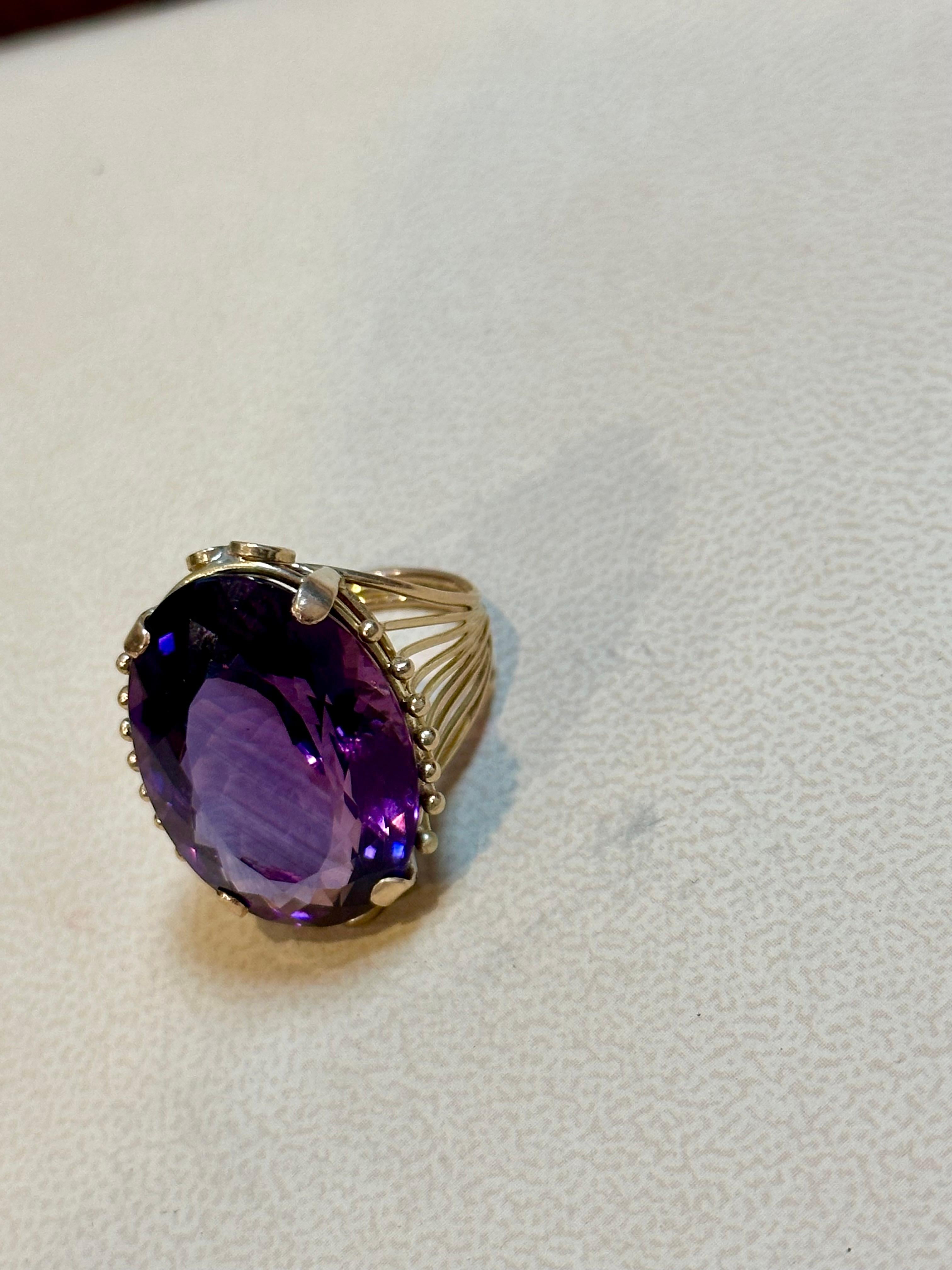 Oval Cut 27 Carat Amethyst Cocktail Ring in 14 Karat Yellow Gold For Sale
