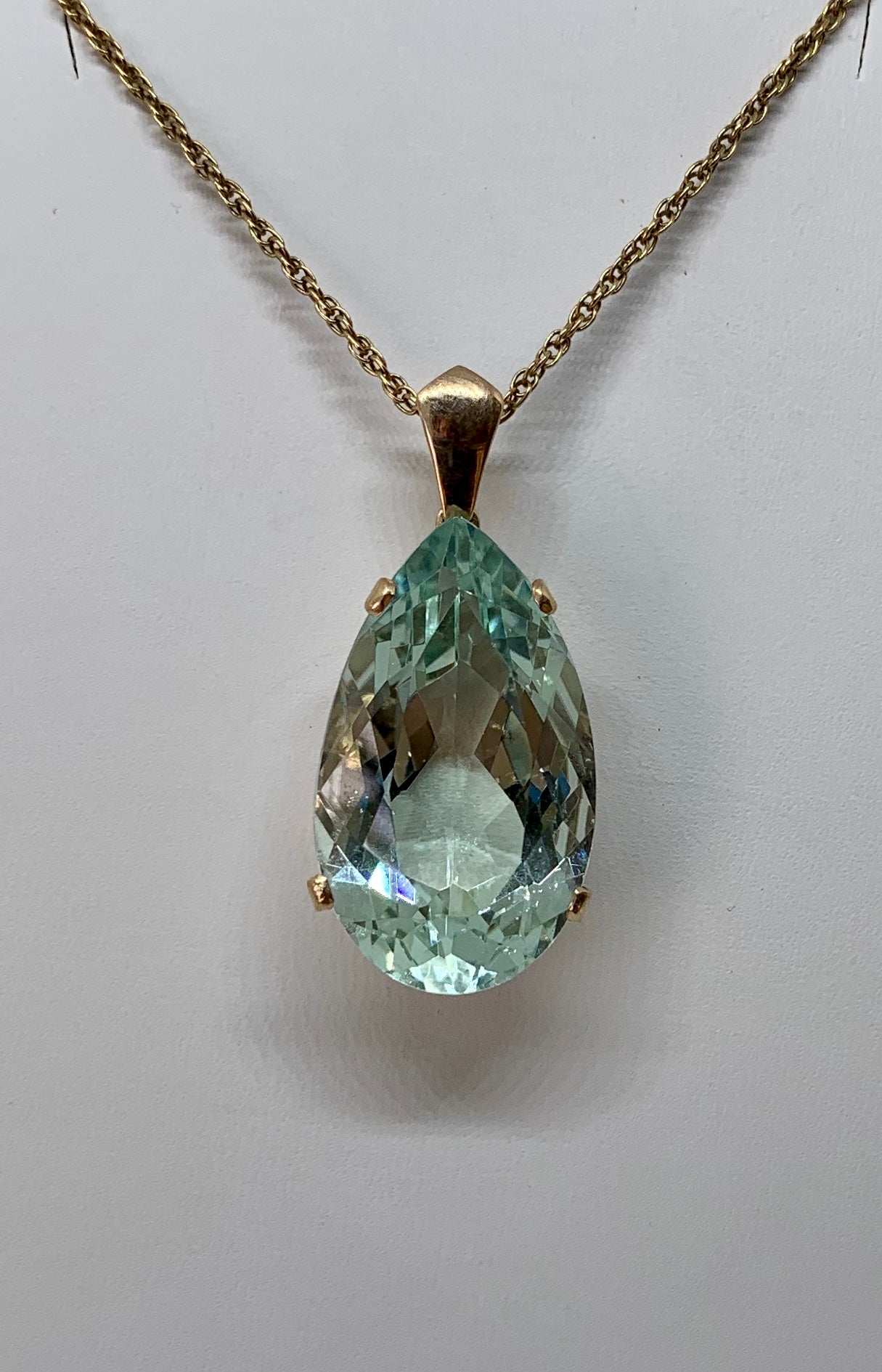 We are so delighted to have this extraordinary 27.13 Carat antique pear shape natural Aquamarine Pendant.  The magnificent aquamarine is 29mm long, over an inch, and the gem has exquisite shape, color and cut.  The radiance of the monumental aqua is