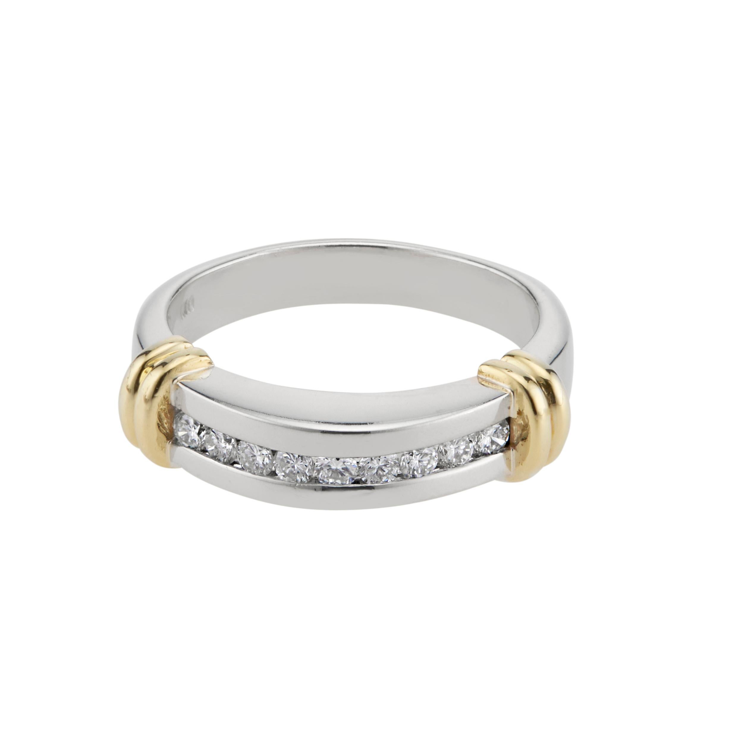 Diamond domed top white gold band ring. Set in 14k white gold with 9 full cut diamonds with 14k yellow gold accents. 

9 full cut diamonds, approx. total weight .27cts, H, SI
Size 7 and sizable
14k white gold
Stamped: 14k
Tested: 14k
Hallmark: