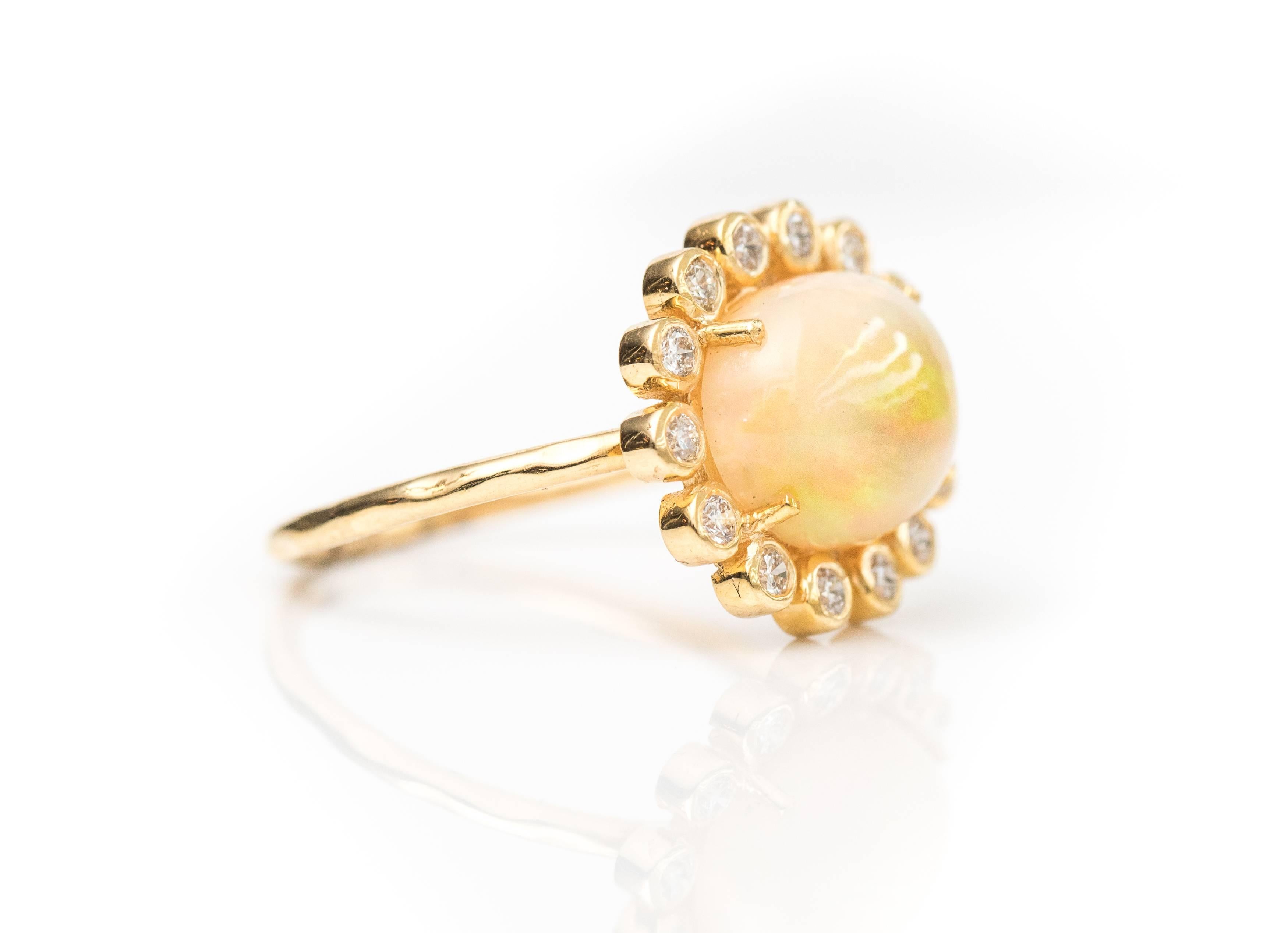 Modern 2.7 Carat Opal with Diamond Halo, 18 Karat Yellow Gold Ring For Sale