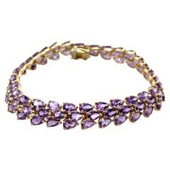Bracelet en améthyste poire 27 carats et or jaune 14k