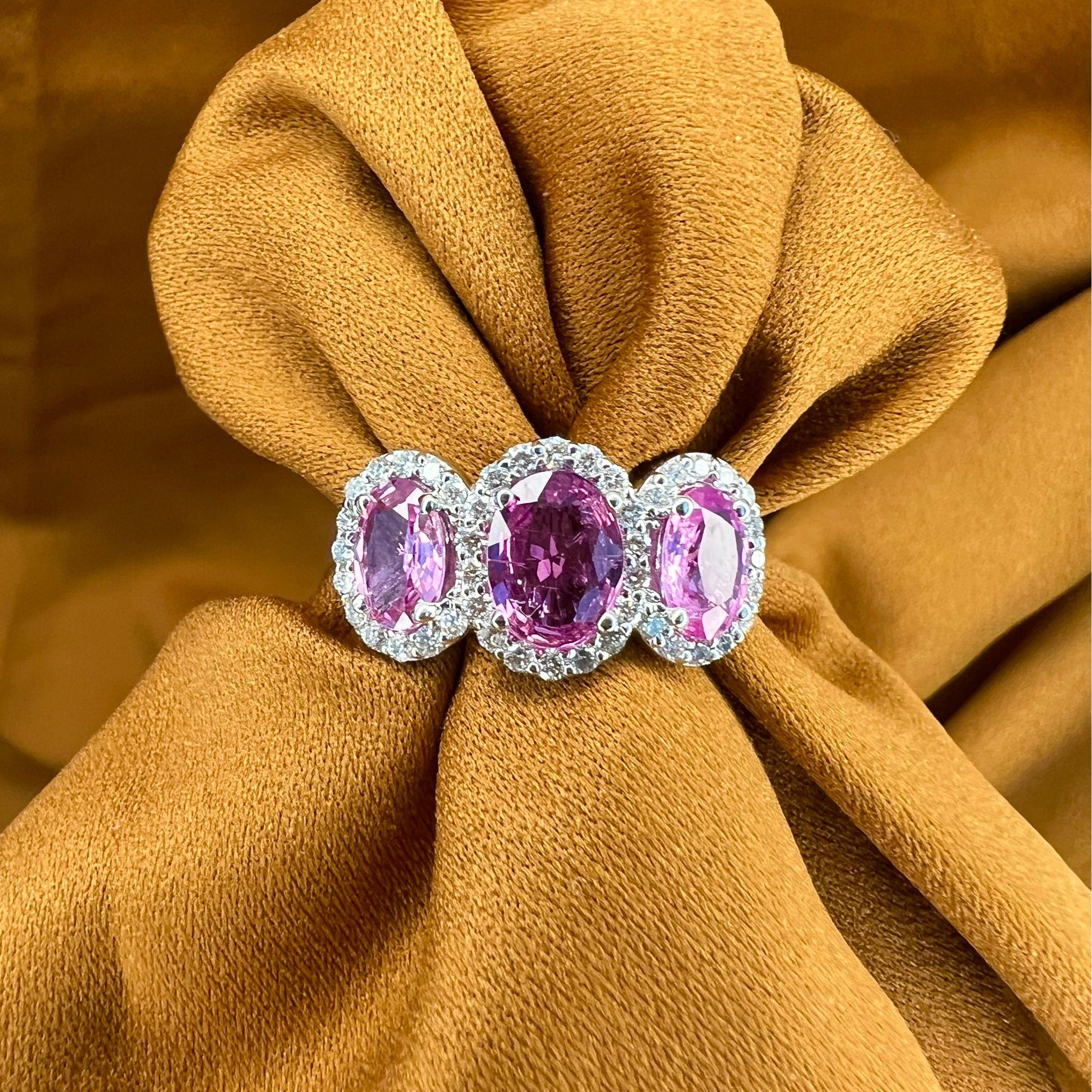Sapphire Weight: 2.71 CTs
Measurements: 8x6/7x5 mm
Diamond Weight: 0.48 CTs
Metal: 18K White Gold 
Gold Weight: 5.46 gm
Ring Size: 7
Shape: Oval
Color: Pink
Hardness: 9
Birthstone: September
Product ID: MUR25317/Line 8