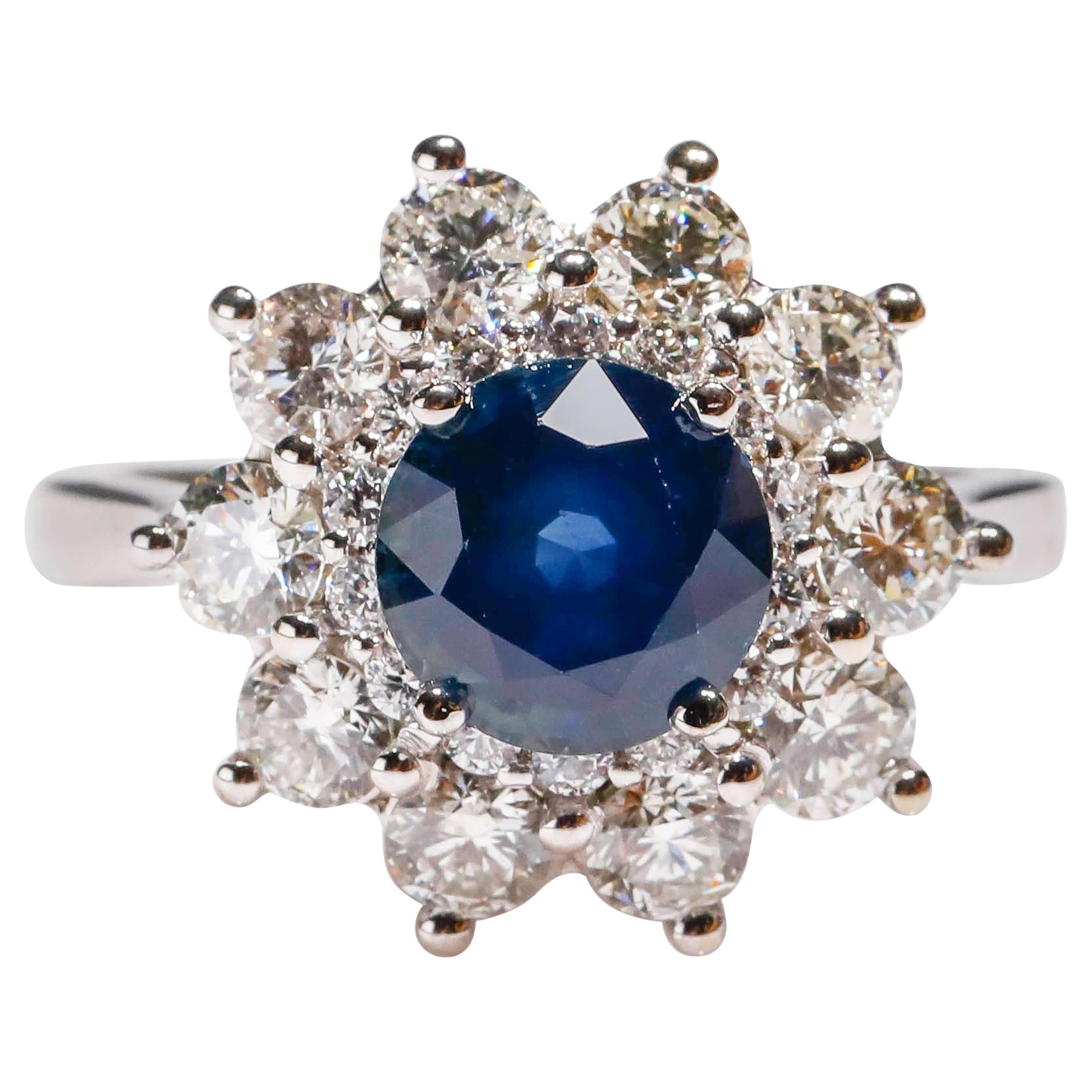 2.7 Carat Round Blue Sapphire 1.9 Carat Diamond 14 Karat Gold Floral Halo Ring

Crafted in 14 kt White Gold, this Unique design showcases a Blue Sapphire 2.7 TCW round-shaped Sapphire, set in a halo of round-cut mesmerizing diamonds, Polished to a