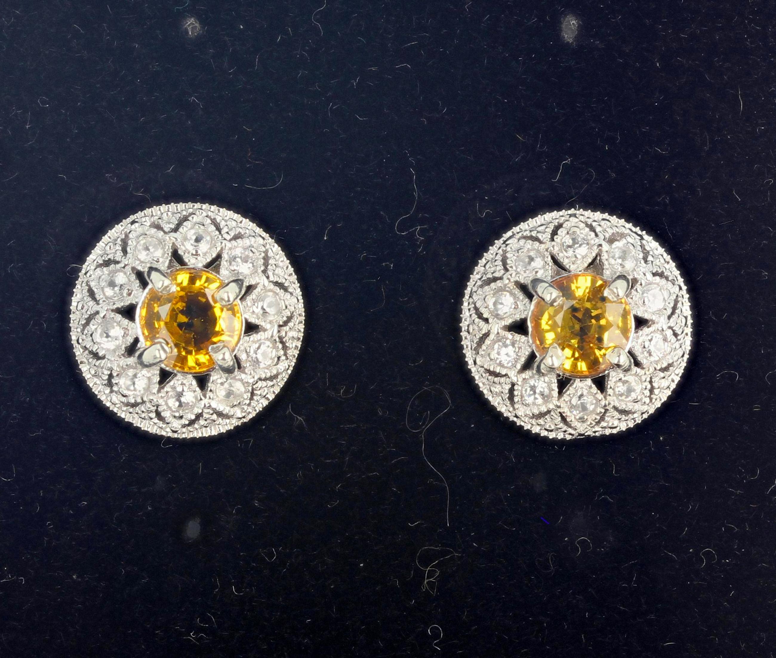 These brilliant 2.7 carats of round unique RARE yellow Songea Sapphires (6 mm) are enhanced with brilliant teeny tiny Diamonds in white gold rhodium plated (platinum) sterling silver stud earrings.  The earrings are approximately 13 mm in diameter. 