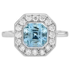 2.7 Ct. Bague de fiançailles Halo en or 14K avec topaze bleue et diamant de style Art déco