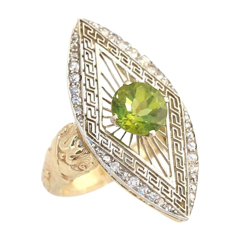 Peridot Platinum Yellow Gold European Ring Boxed.
Platinum and Yellow Gold used together was a common technique of the period in Europe. The grid and Diamond cast is Platinum, while the rest of the ring is Gold with fine ornamentation. The ring