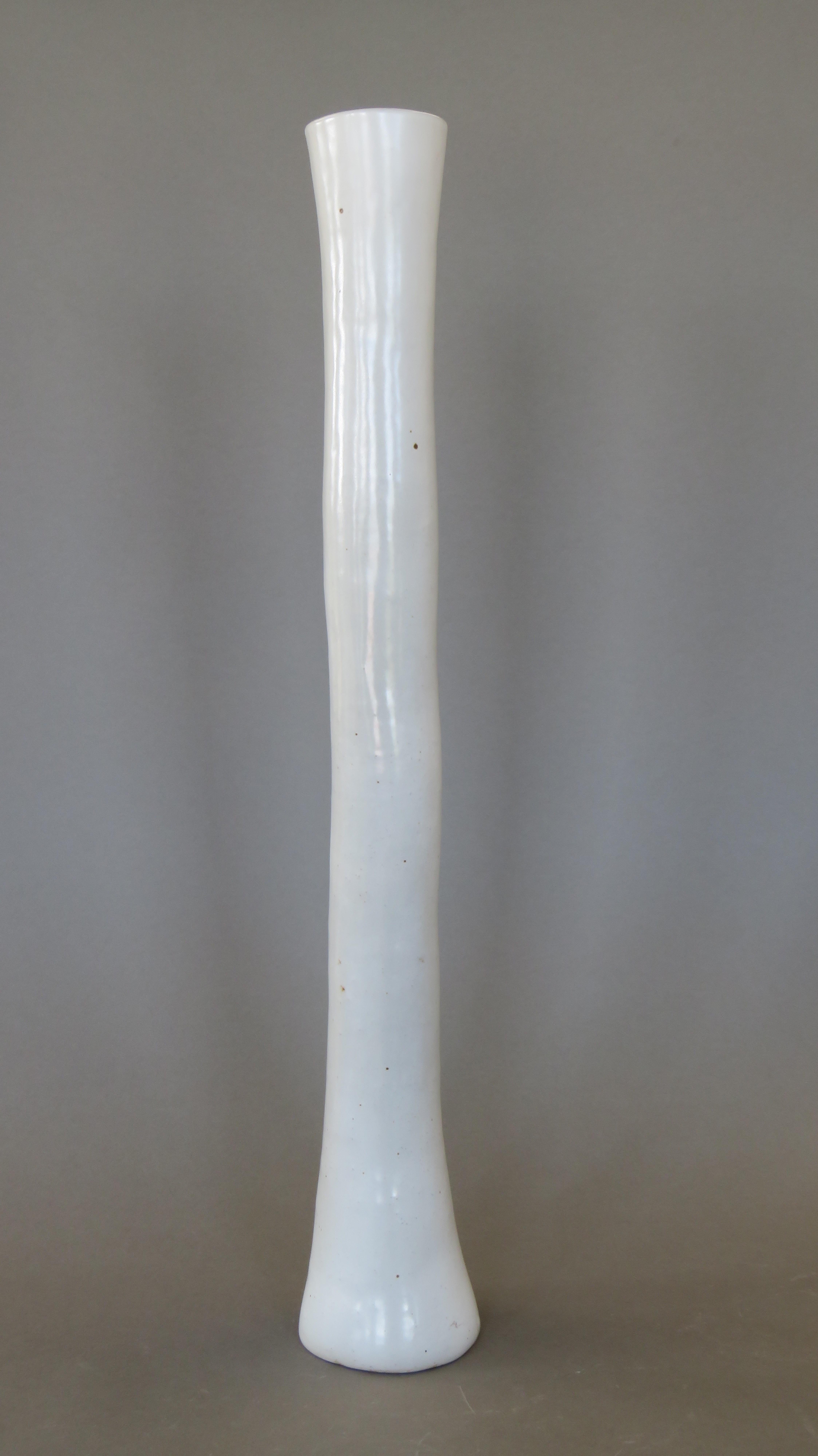 Very Tall, Sculptural Hand Built White Vase.  This series of vases was made as an investigation into functional sculpture, not just as ordinary vases but true statement pieces.  Echoing the flow of air or the sound of music, these elongated vessels,