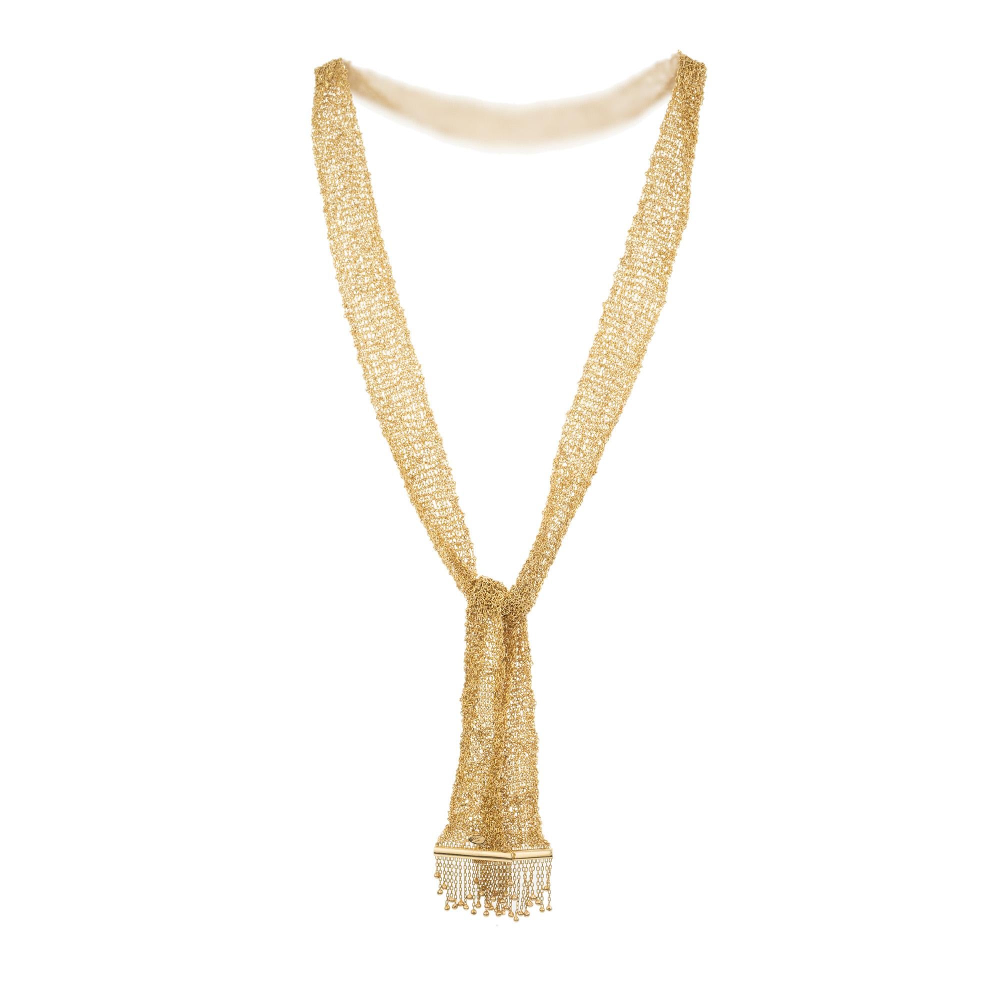Unique and stunning 14k yellow gold tassel necklace. Wonderfully rich golden color and sparkle from every inch of this .27 Inch long and 2.83 inch wide mesh necklace made from multiple chains put together with a tassel ends. It can born at multiple