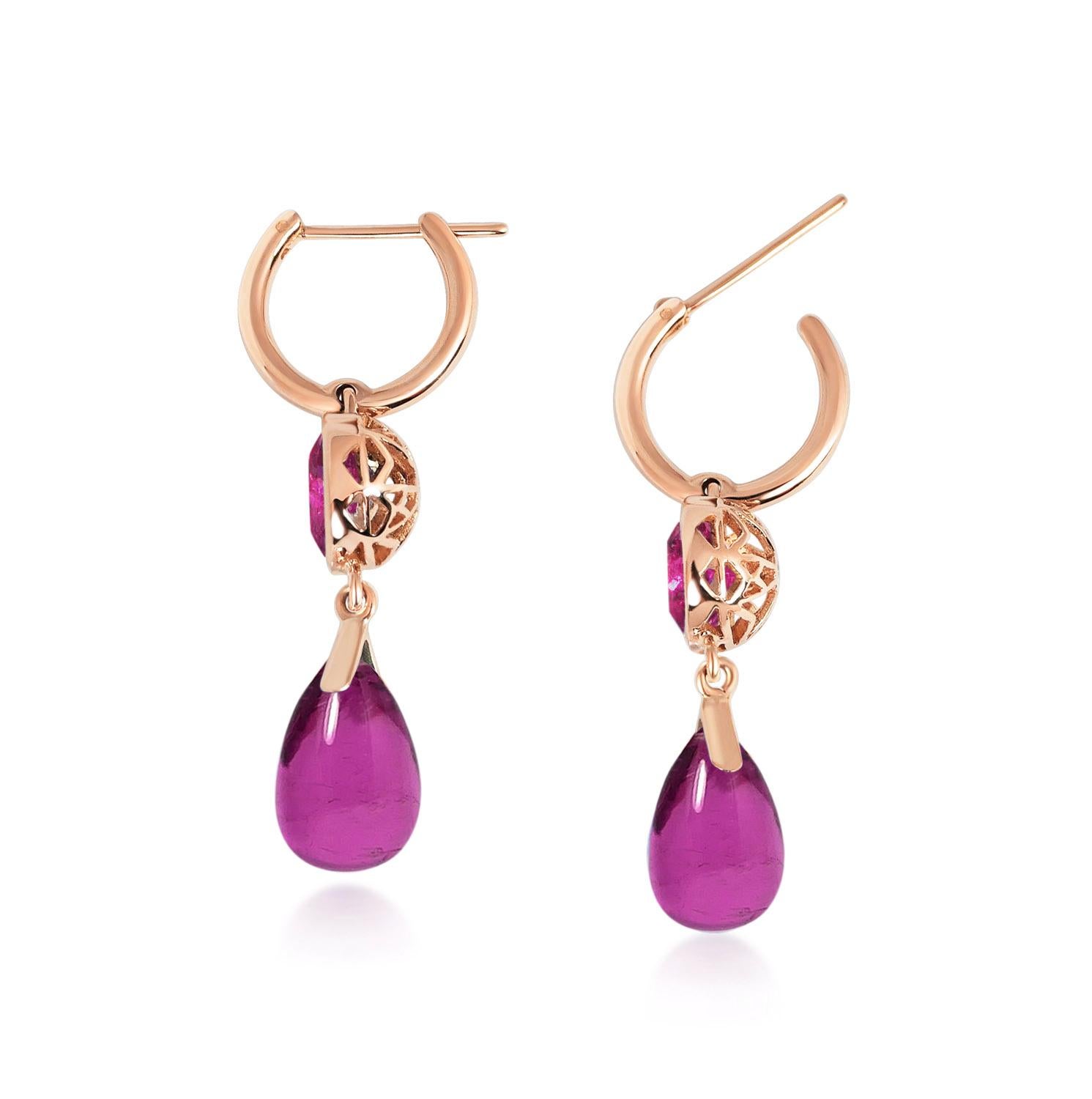 Handcrafted 2.60 & 7.10 Carats Pink Tourmalines 18 Karat Rose Gold Drop Earrings. Dancing drops carved in Pink Tourmaline under a set of round cut 8mm Pink Tourmaline stones encased in our iconic hand pierced gold lace to let the light through. A