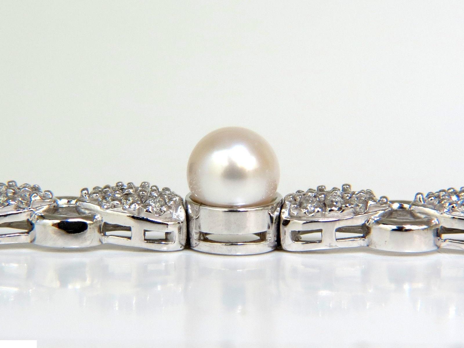 (8) 6.50mm Akoya pearls

2.28ct. Round diamonds

Classic Petal & Link deco

G-color

Vs-2 clarity.

14kt. White gold

17.5 grams 

$7,000 appraisal will accompany

7 inches = wearable length

6.5mm wide

Depth: 8mm

 secure safety and pressure clasp.