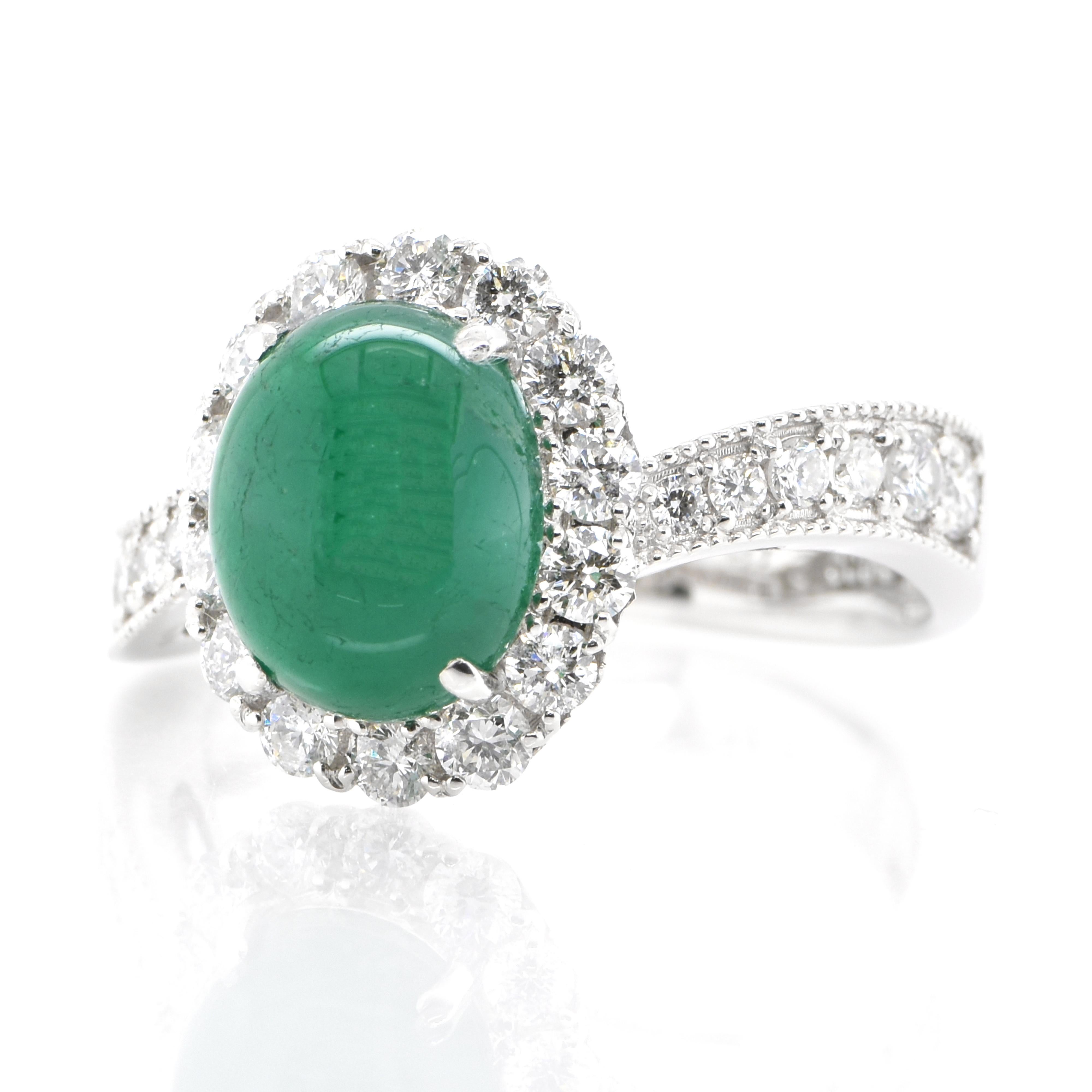 A stunning ring featuring a 2.70 Carat Natural Emerald Cabochon and 0.82 Carats of Diamond Accents set in Platinum. People have admired emerald’s green for thousands of years. Emeralds have always been associated with the lushest landscapes and the