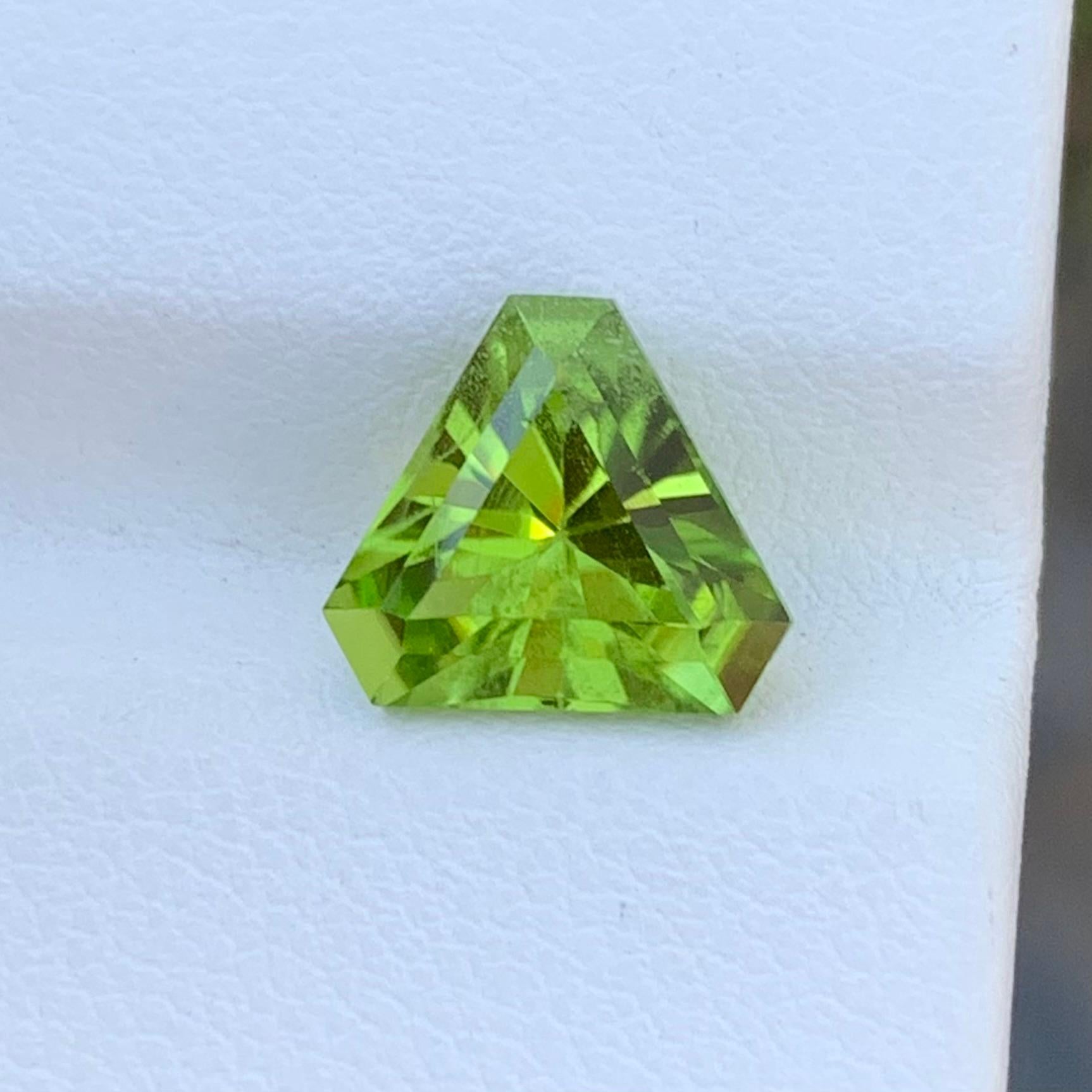 Loose Peridot 
Weight: 2.70 Carats 
Dimension: 8.4 x 8.4 x 5.6 Mm
Origin: Supat Valley, Pakistan 
Colour: Green 
Shape: Trillion
Treatment: Non 
Certificate: On Demand 

Peridot, a gemstone that radiates a vibrant green hue, is renowned for its
