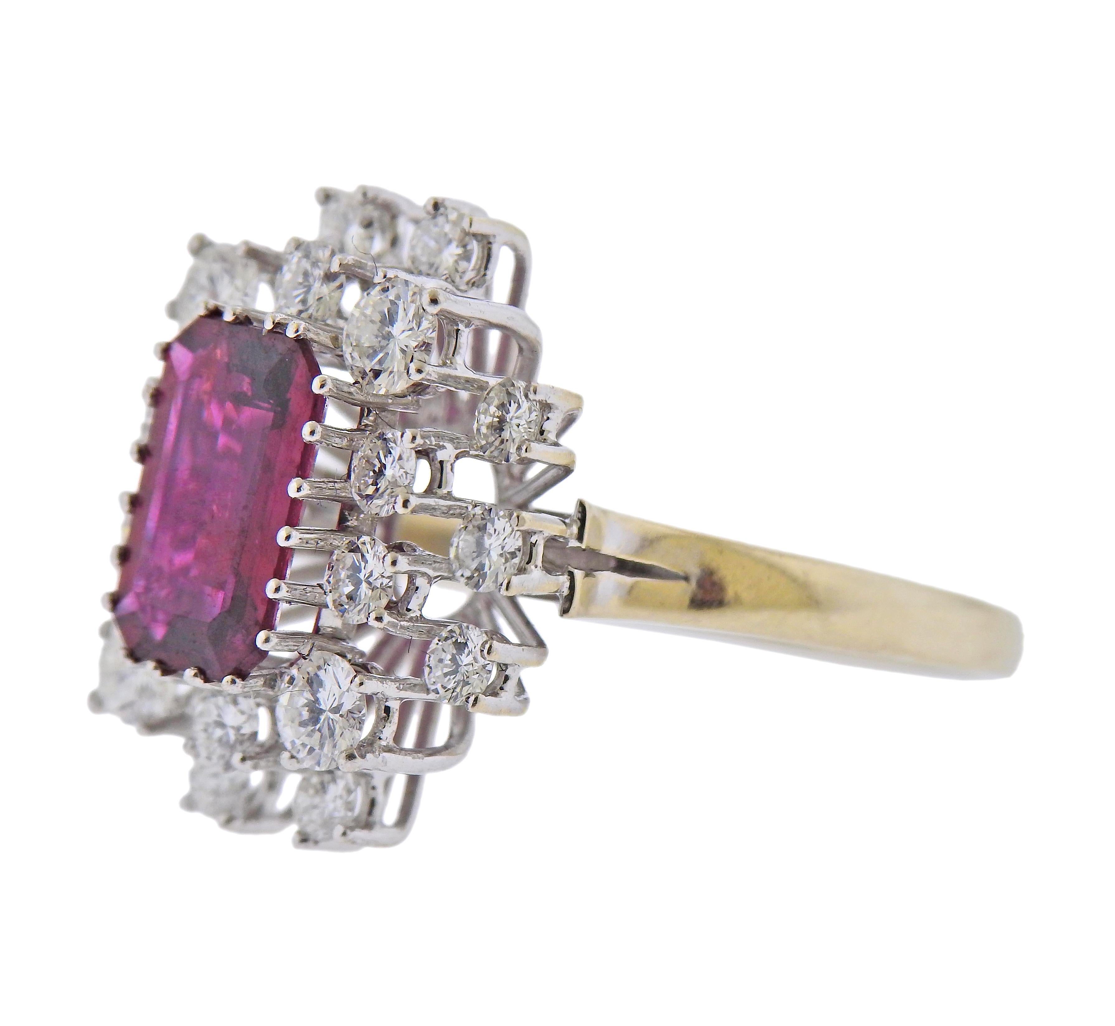 14k white gold cluster ring, with center approx. 2.70ct ruby, surrounded with approx. 2.10ctw in diamonds. Ring size - 11.25, ring top - 21mm x 18mm. Marked: 585, Elsa. Weight - 6.9 grams.