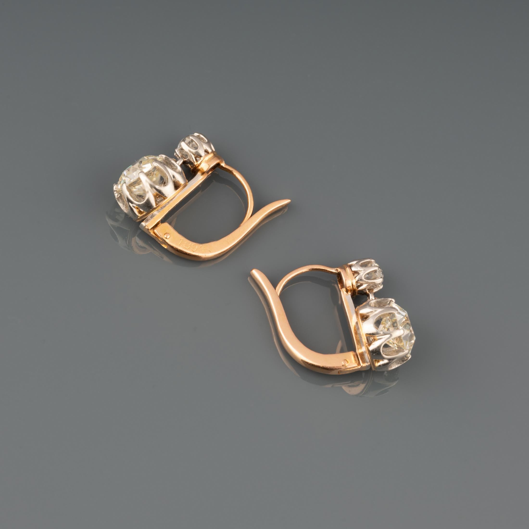 A very lovely antique pair of earrings, made in France circa 1900.  (There is a number 1894, maybe the date of making).

Made in rose gold 18k and platinum.

The two principal round old European cut diamonds weights 1.25 Carats each approximately.