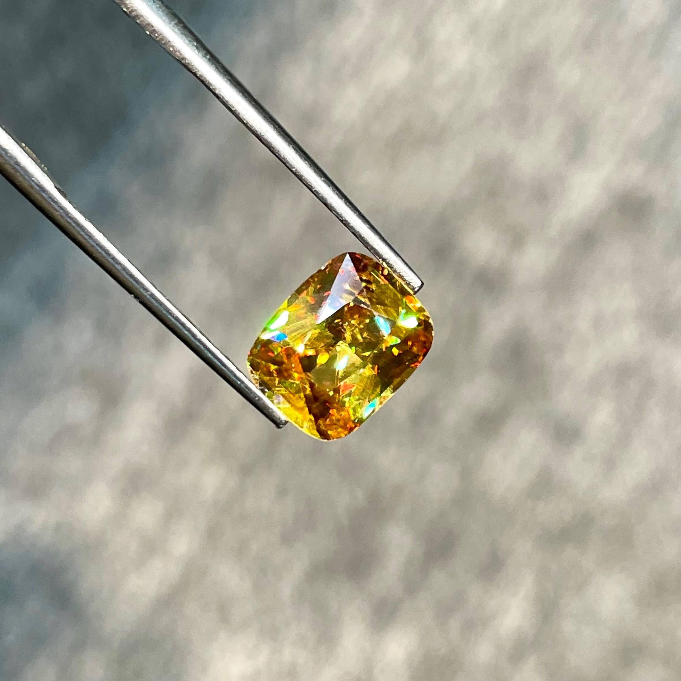 Weight 2.70 carats 
Dimensions 9.4x7.6x4.8 mm
Treatment none 
Origin Madagascar 
Clarity VVS
Shape cushion
Cut fancy cushion 




The 2.70-carat Fire Luster Sphene Stone, with its mesmerizing Fancy Cushion Cut, stands as a radiant testament to