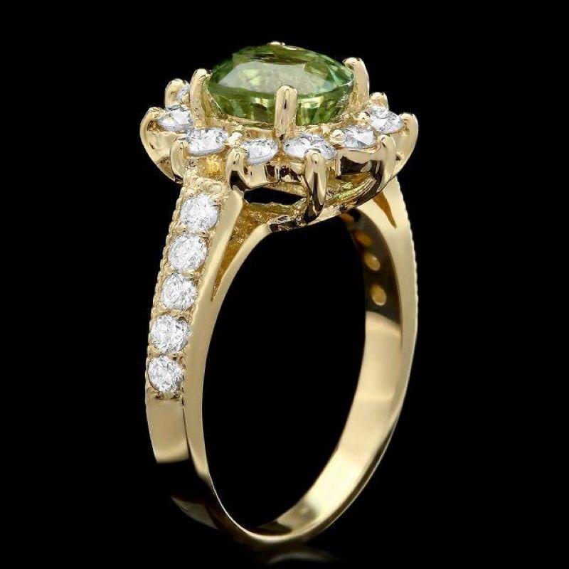 2.70 Carats Natural Very Nice Looking Green Tourmaline and Diamond 14K Solid Yellow Gold Ring

Total Natural Oval Cut Tourmaline Weight is: Approx. 1.70 Carats 

Tourmaline Measures: Approx. 8.00 x 7.00mm

Natural Round Diamonds Weight: 1.00 Carats