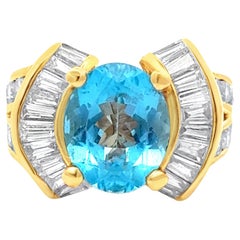 Anello vintage in oro giallo con topazio blu taglio ovale e diamanti da 2,70 carati