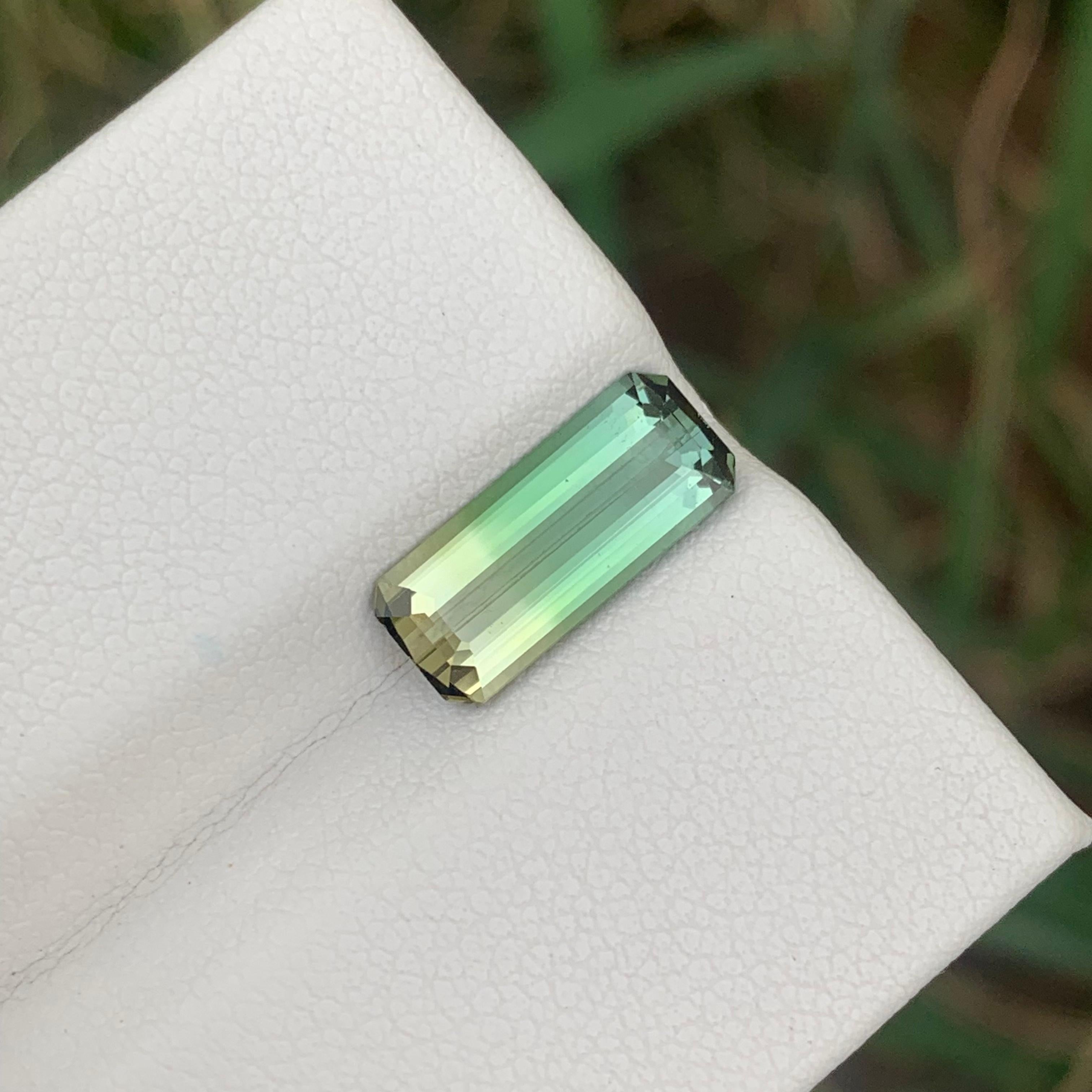 Bicolor Tourmaline 
Weight: 2.70 Carats 
Dimension: 13.9x6x3.9 Mm
Origin: Madagascar Africa 
Color: Green & Yellow 
Treatment: Non
Certificate: On Customer Demand 
Shape: Emerald 
Bicolor tourmaline, a fascinating gemstone composed of two distinct