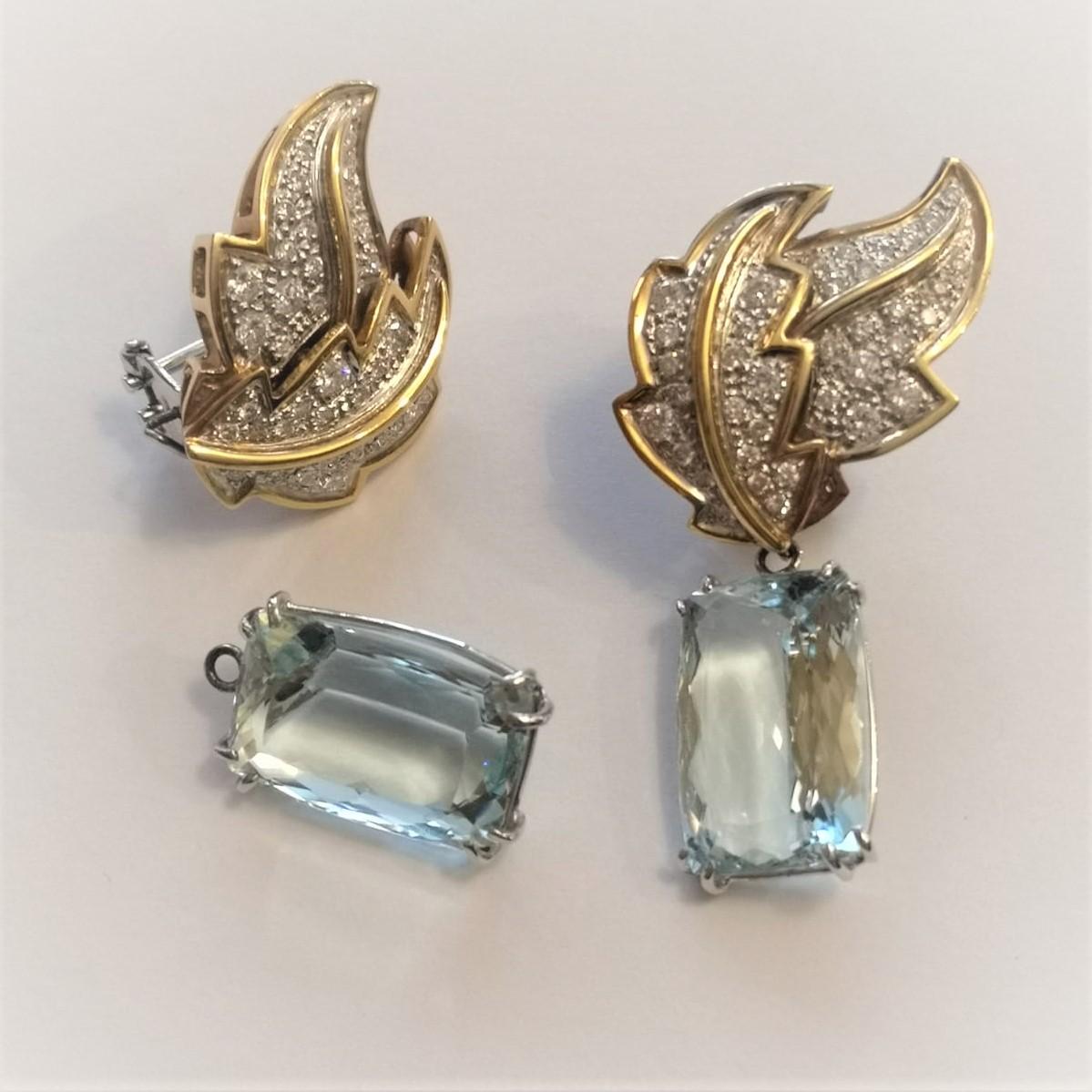 Drop Earrings with 27.00 Total Carat Aquamarine and  1.00 Carat Round Brilliant Cut Diamonds.
The upper part of the earrings is  white and yellow gold 18 Kt.

The high quality of this jewels is the expression of the skilful work of our goldsmiths