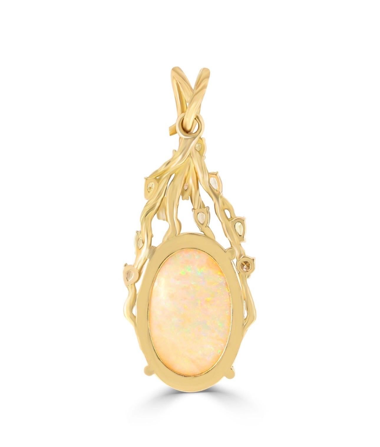 This breathtaking pendant showcases the raw power and natural beauty of the Opal gemstone. The mesmerizing play of colors dances across the 28.5mm opal, drawing the eye in with its captivating brilliance. Framed by the intricate 18 carat gold