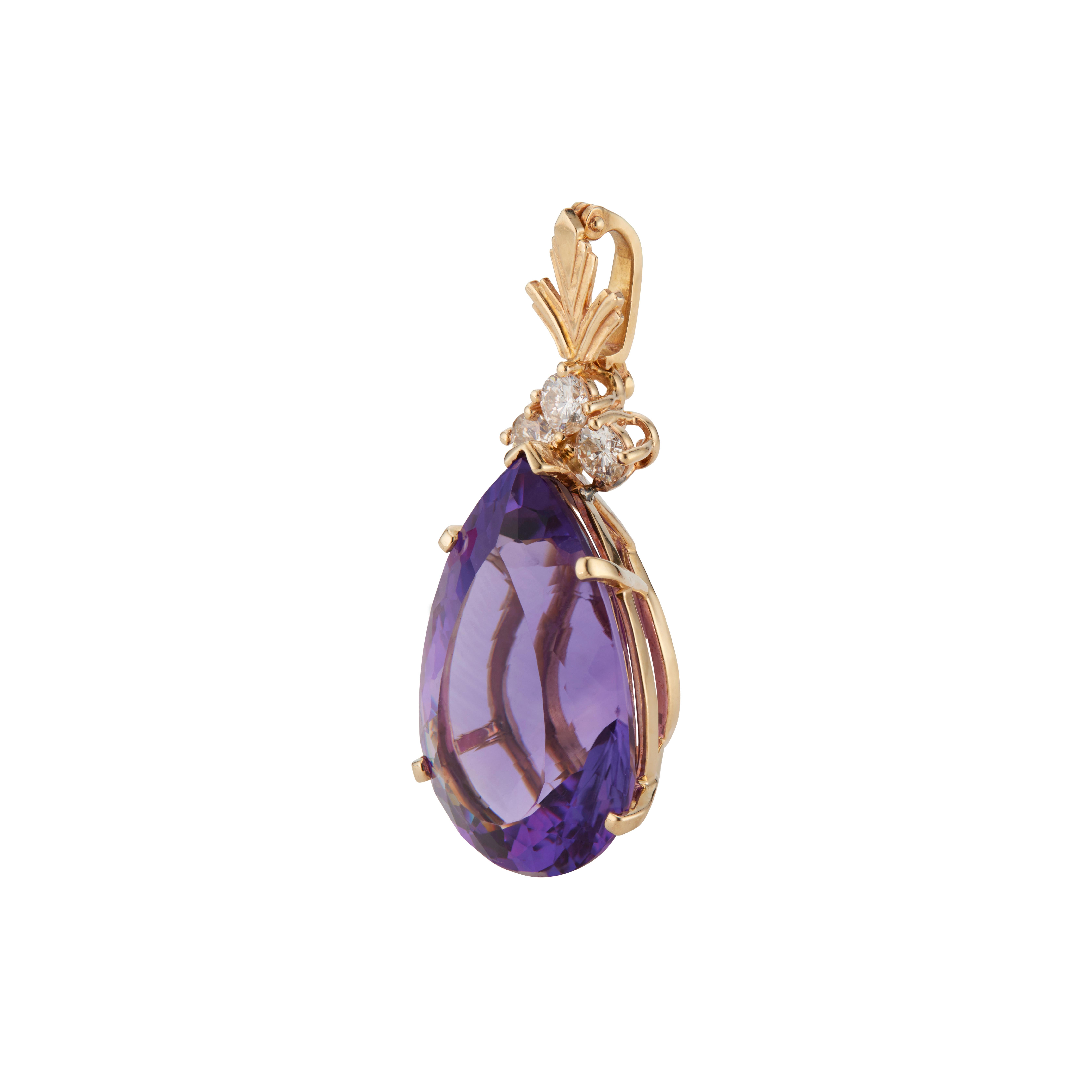 Pear shaped purple Amethyst and diamond pendant. 27.00ct amethyst with 3 bright brilliant cut accent diamonds set in a classic pendant enhancer from the designer, Boom. Hinged enhancer bail.

1 pear shaped genuine bright reddish purple Amethyst,