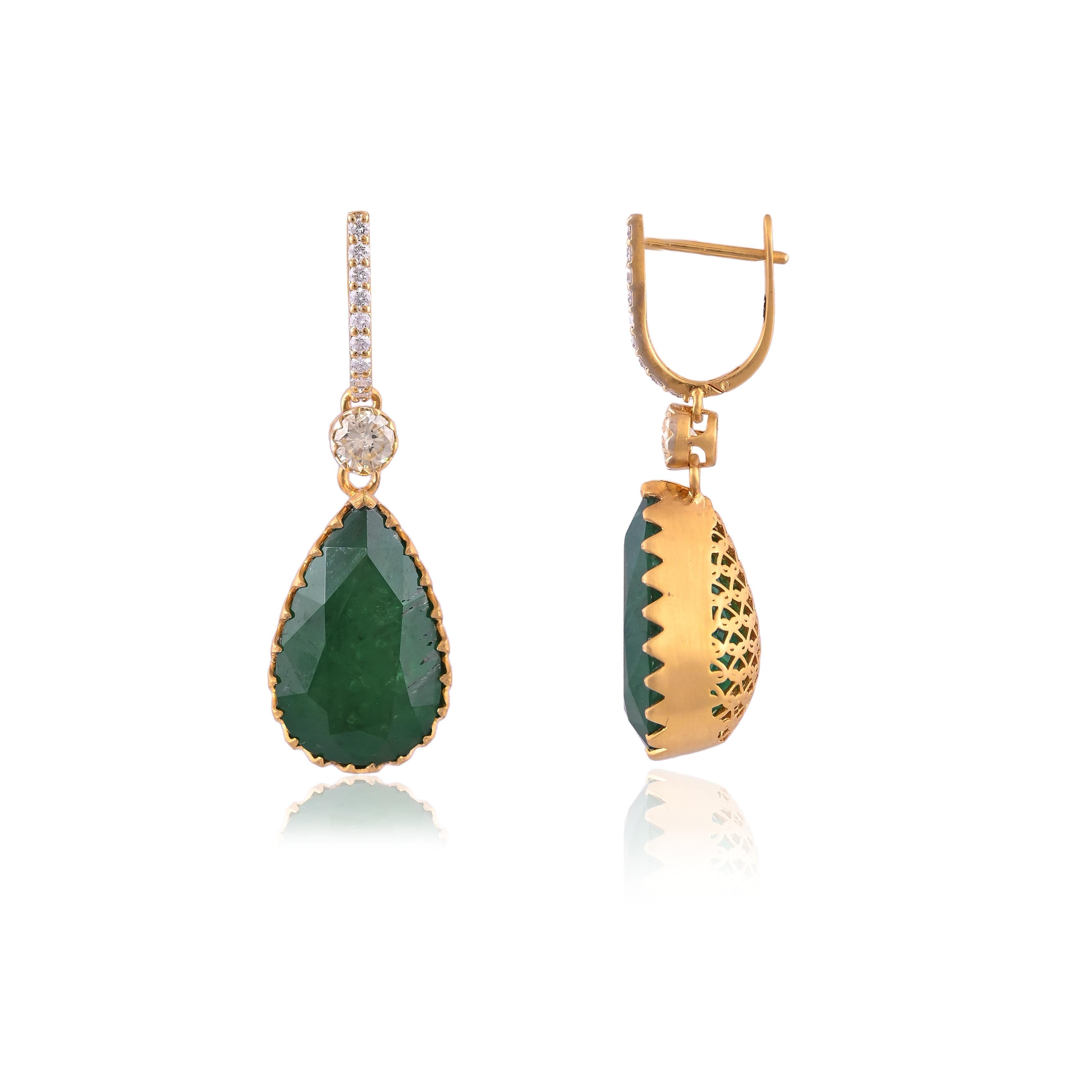 A very beautiful Emerald Chandelier/ Dangle Earrings set in 18K Gold & Diamonds. The Emeralds are of Zambian origin and weighs 27.04 carats. The Emeralds are completely natural without any treatment. The weight of the Diamonds is 1.13 carats. The