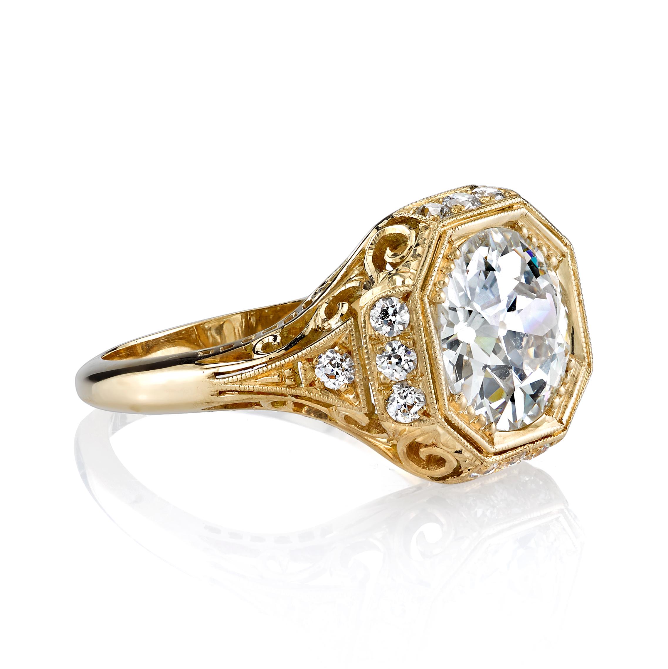 2.70ct I/VS2 GIA certified old European cut diamond set in a handcrafted 18k Yellow Gold mounting with 0.43ctw accent stones. A classic Edwardian inspired design featuring an octagonal frame and filigree.