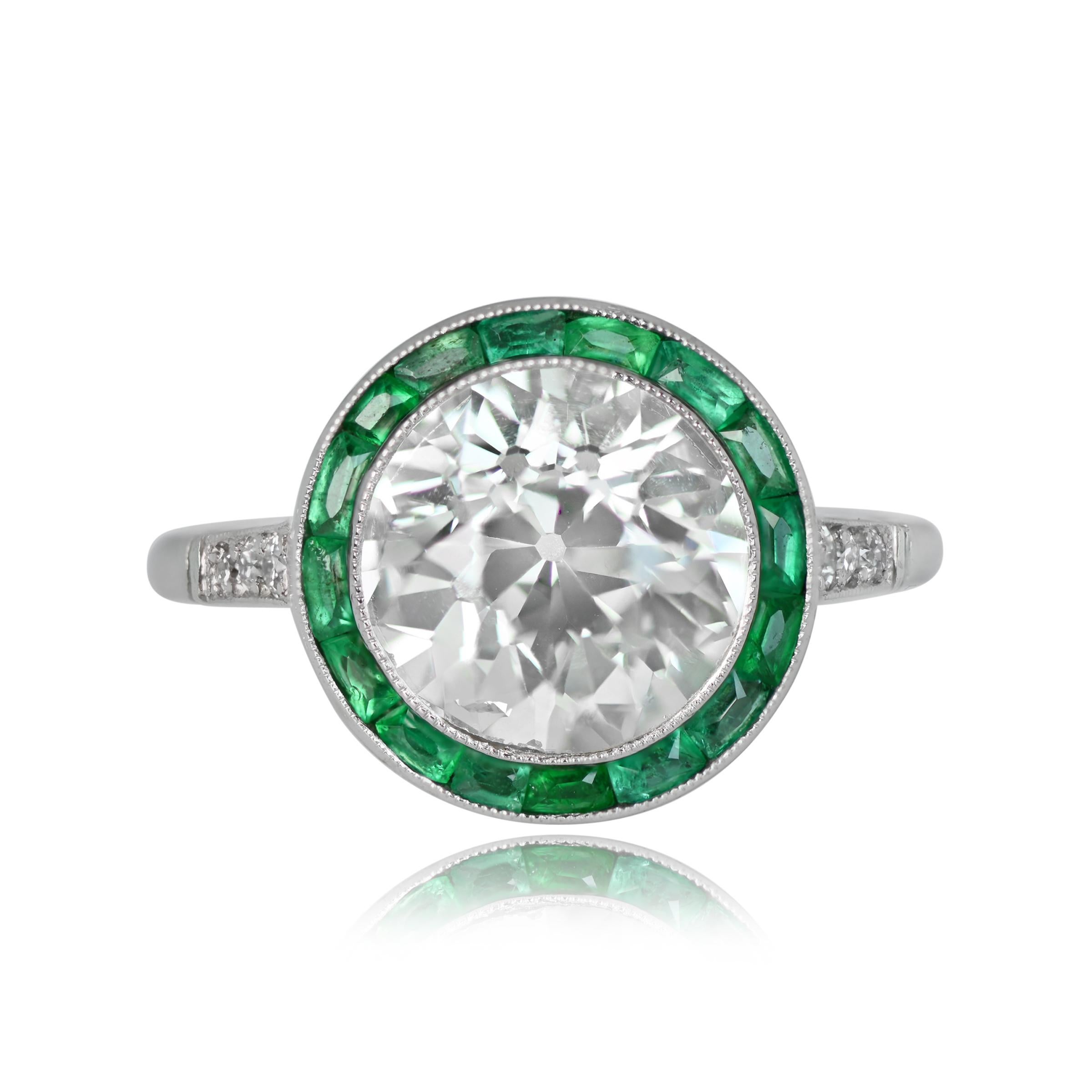 Art Deco-style platinum engagement ring with 2.70ct L color, VS2 clarity old European cut diamond. Halo of calibre natural green emeralds, three round pave set diamonds on each shoulder, and fine open-work and filigree under gallery.

Ring Size: 6.5