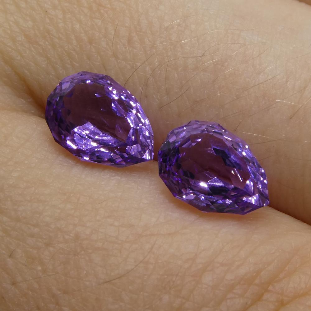 Description:

Gem Type: Amethyst
Number of Stones: 2
Weight: 2.7 cts
Measurements: 9.00 x 6.00 x 4.40 mm
Shape: Pear
Cutting Style Crown: Modified Brilliant
Cutting Style Pavilion: Mixed Cut
Transparency: Transparent
Clarity: Very Slightly Included:
