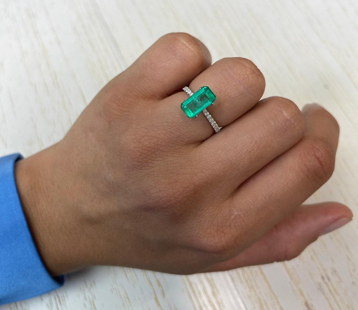 Stone: Emerald
Weight: 2.70-carats
Shape: Emerald Cut
Clarity: Transparent
Luster: Excellent
Color: Yellowish Green
Measurements: 11.40mm x 6.15mm x 4.73mm
Geographic Origin: Colombia
Treatment: Natural, Oiling

Comments: Due to their growth