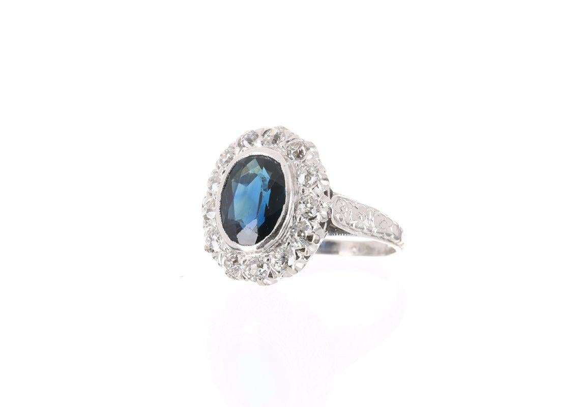 Get ready to receive many compliments! This stunning vintage art deco engagement ring is a dream ring! The combination of platinum, diamond, and sapphire, along with effortless, hand-forged details is truly romantic. The smooth platinum band is
