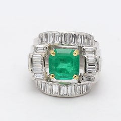 2.71 Carat Emerald 2.66 Carat Baguette Shape G VS2 Diamond Platinum Cluster Ring