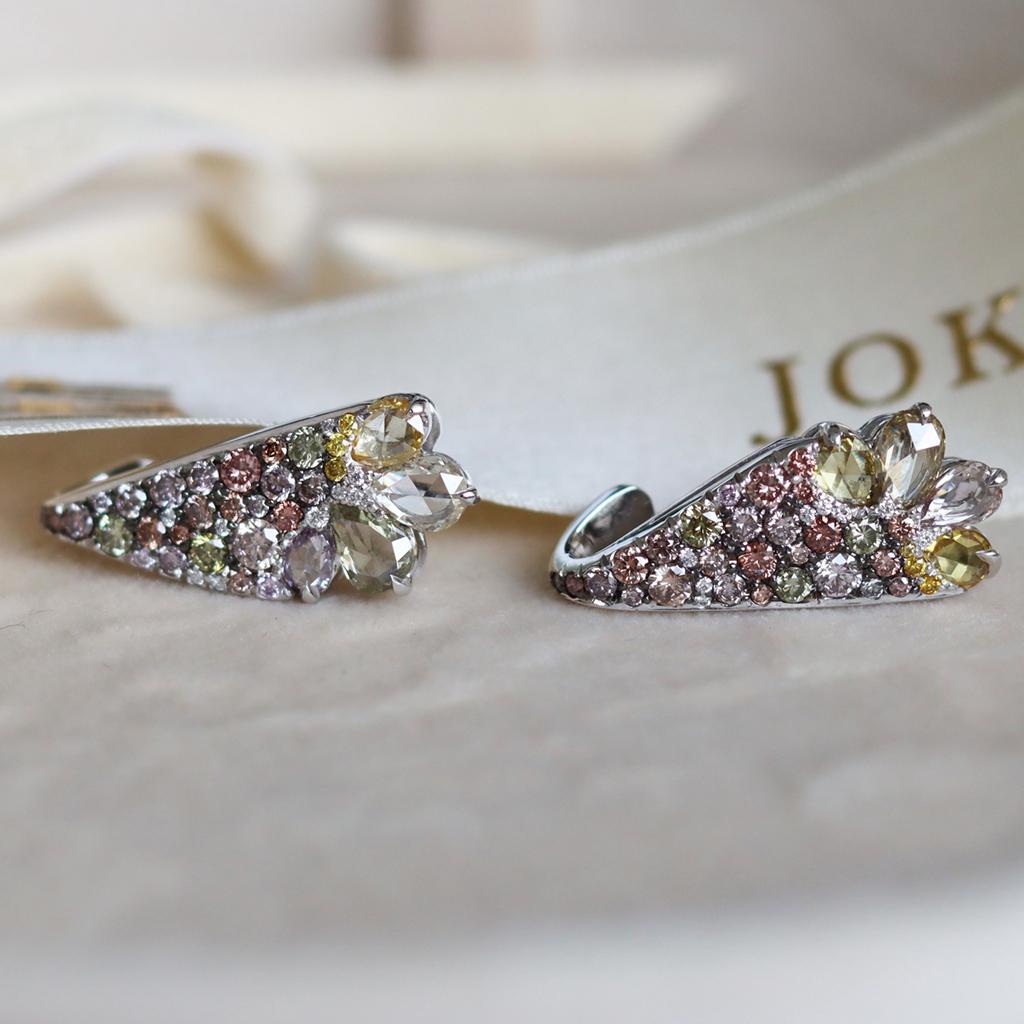 One of a kind Handmade Climber Earrings rotating around the earlobe in 18K White gold 9,8 g. 
Pave set with Fancy Pink, Fancy Green, Fancy yellow & white DEGVVS brilliant-cut diamonds, 
Fancy Pink & Green & yellow rose-cut diamonds. 

Total carat