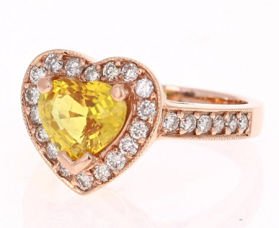 This ring has a 2.02 Carat Heart Cut Natural Yellow Sapphire in the center of the ring and is surrounded by a halo 30 Round Cut Diamonds that weigh 0.69 carats.  The total carat weight of the ring is 2.71 carats.

Curated in 14K Rose Gold and weighs