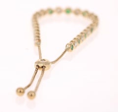 Bracciale flessibile in oro giallo con diamante e smeraldo naturale da 2,71 carati