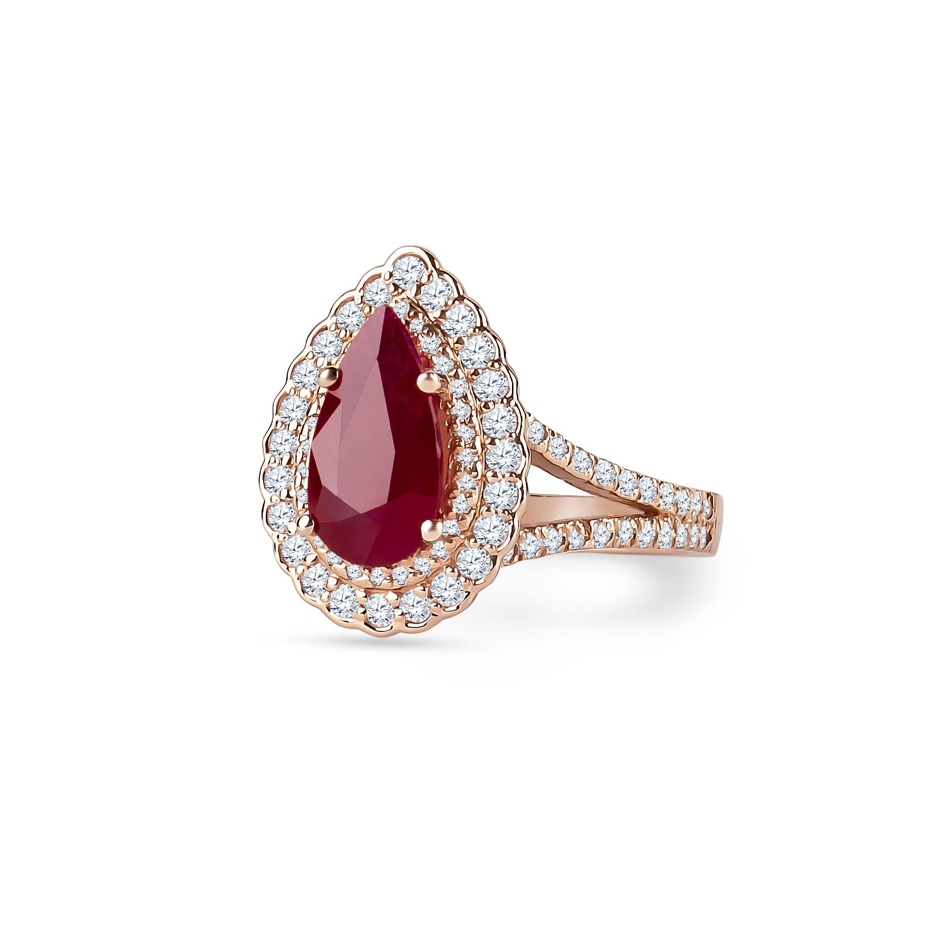 2.71 carat pear shaped ruby with 0.96 carats total weight of round brilliant diamonds in double halo form, set in a 14k rose gold ring with split shank. The ruby is guaranteed natural with standard heat treatment only. Diamond quality: G-I color,